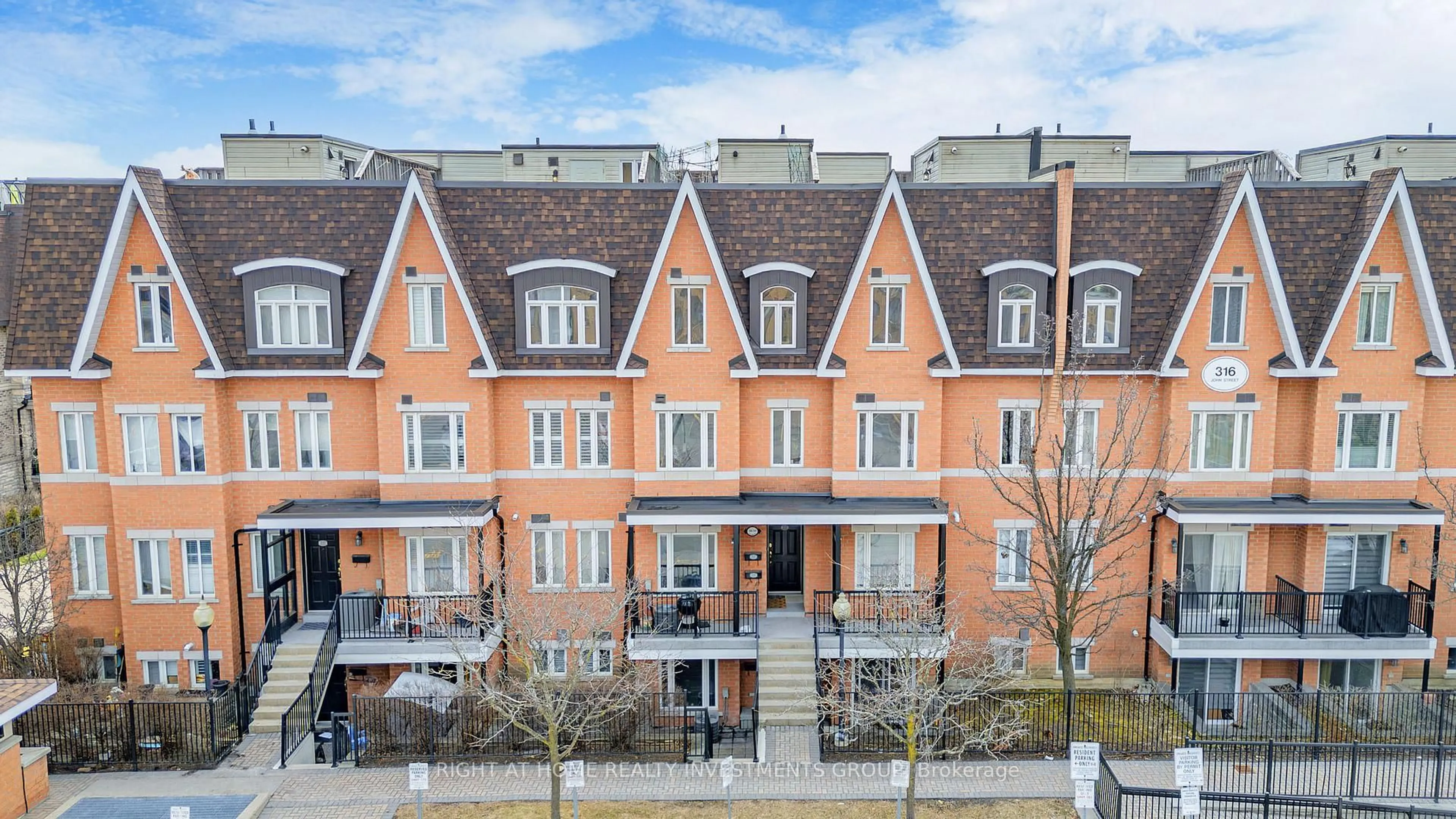A pic from outside/outdoor area/front of a property/back of a property/a pic from drone, city buildings view from balcony for 316 John St #118, Markham Ontario L3T 0A7