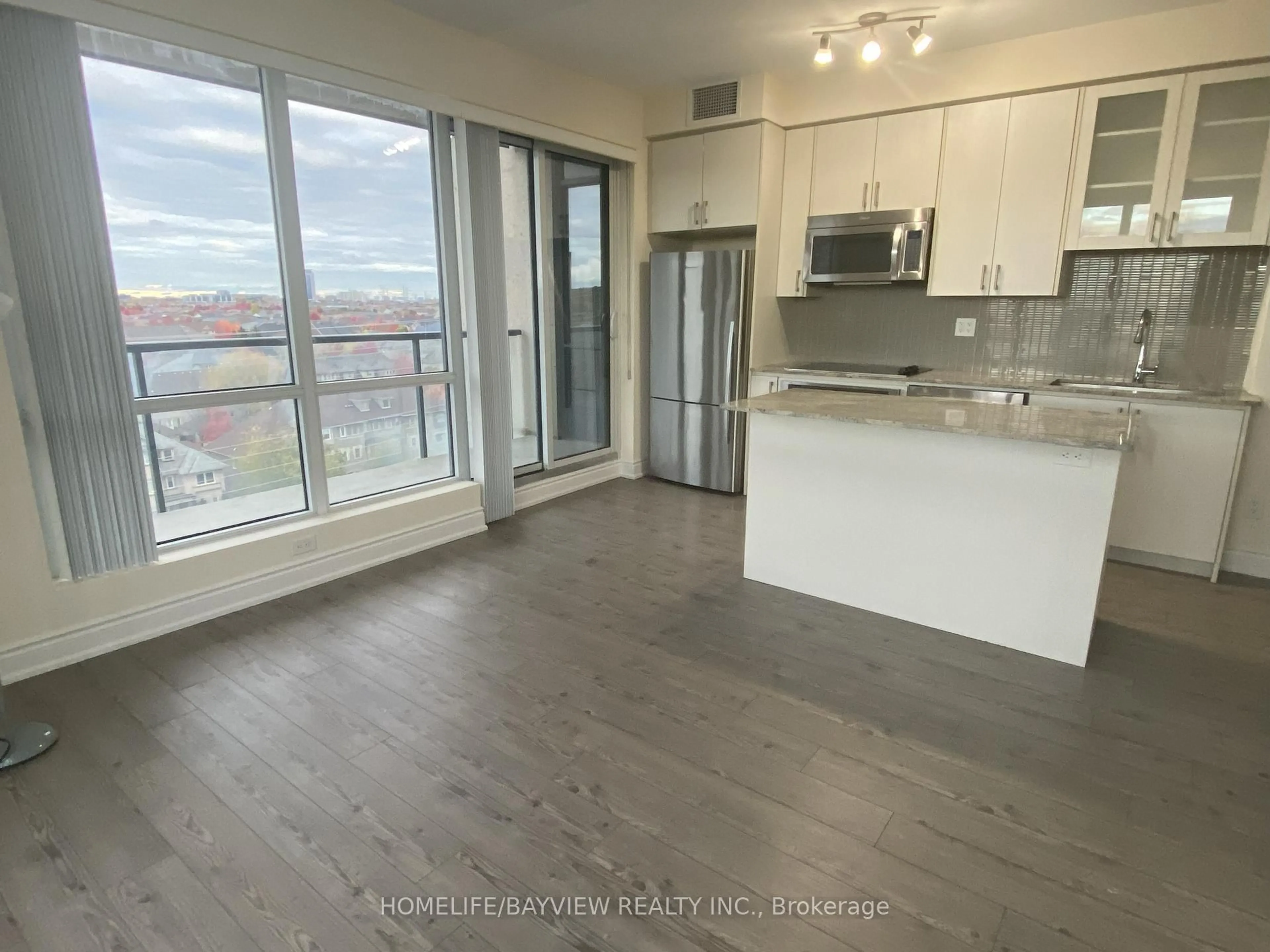 Open concept kitchen, wood/laminate floor for 9090 Yonge St #805B, Richmond Hill Ontario L4C 0Z1