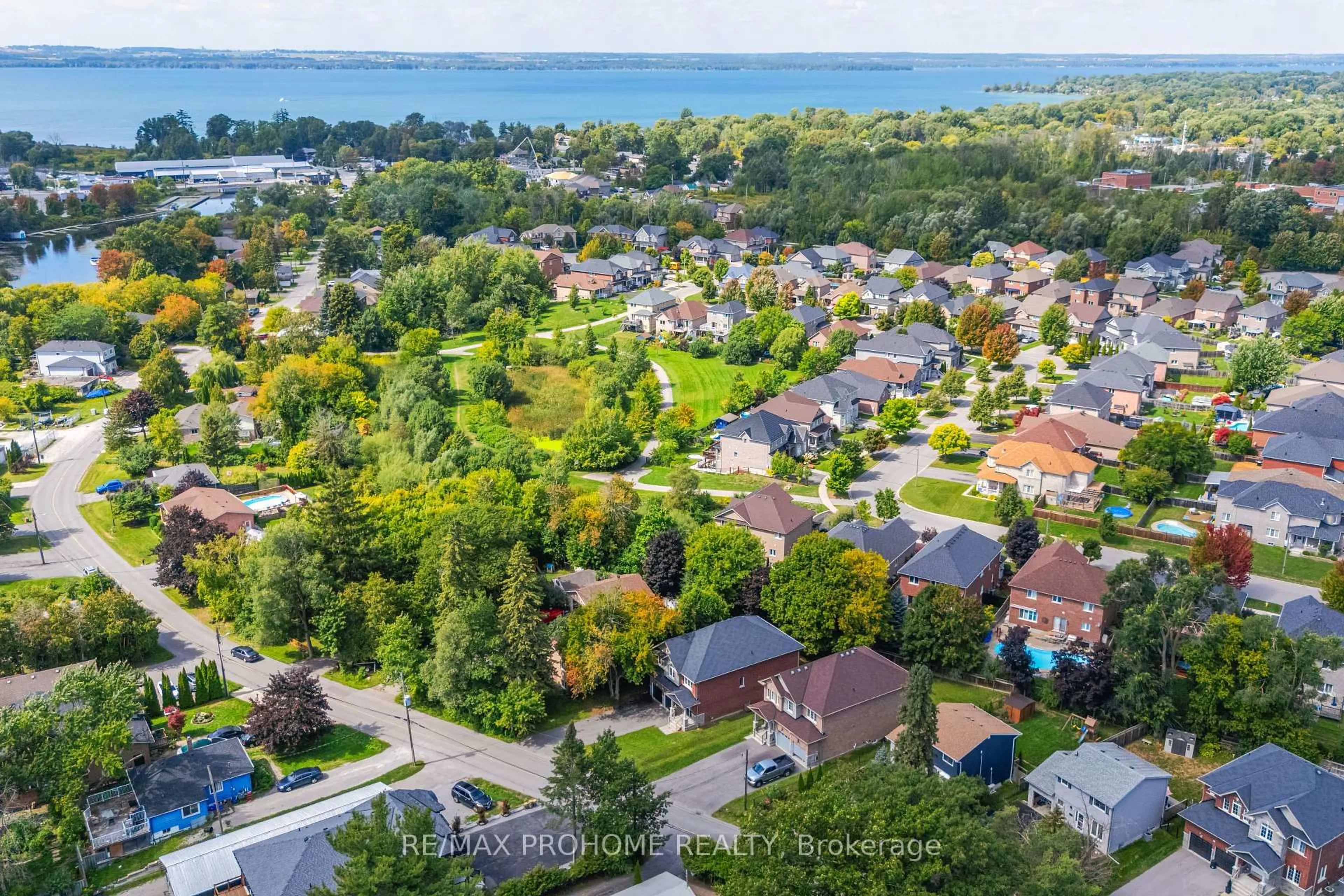 A pic from outside/outdoor area/front of a property/back of a property/a pic from drone, water/lake/river/ocean view for 102 Riveredge Dr, Georgina Ontario L4P 2P1