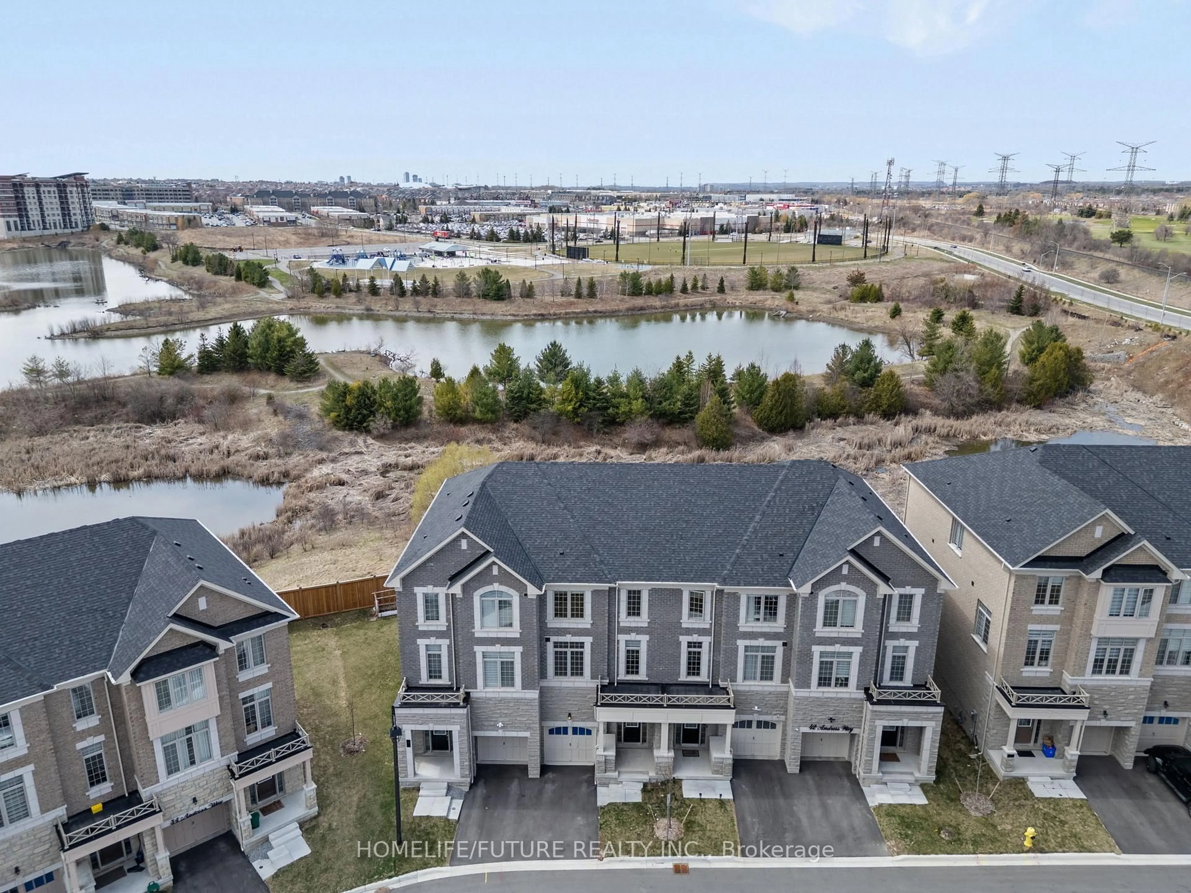 A pic from outside/outdoor area/front of a property/back of a property/a pic from drone, water/lake/river/ocean view for 38 Andress Way, Markham Ontario L3S 0E9