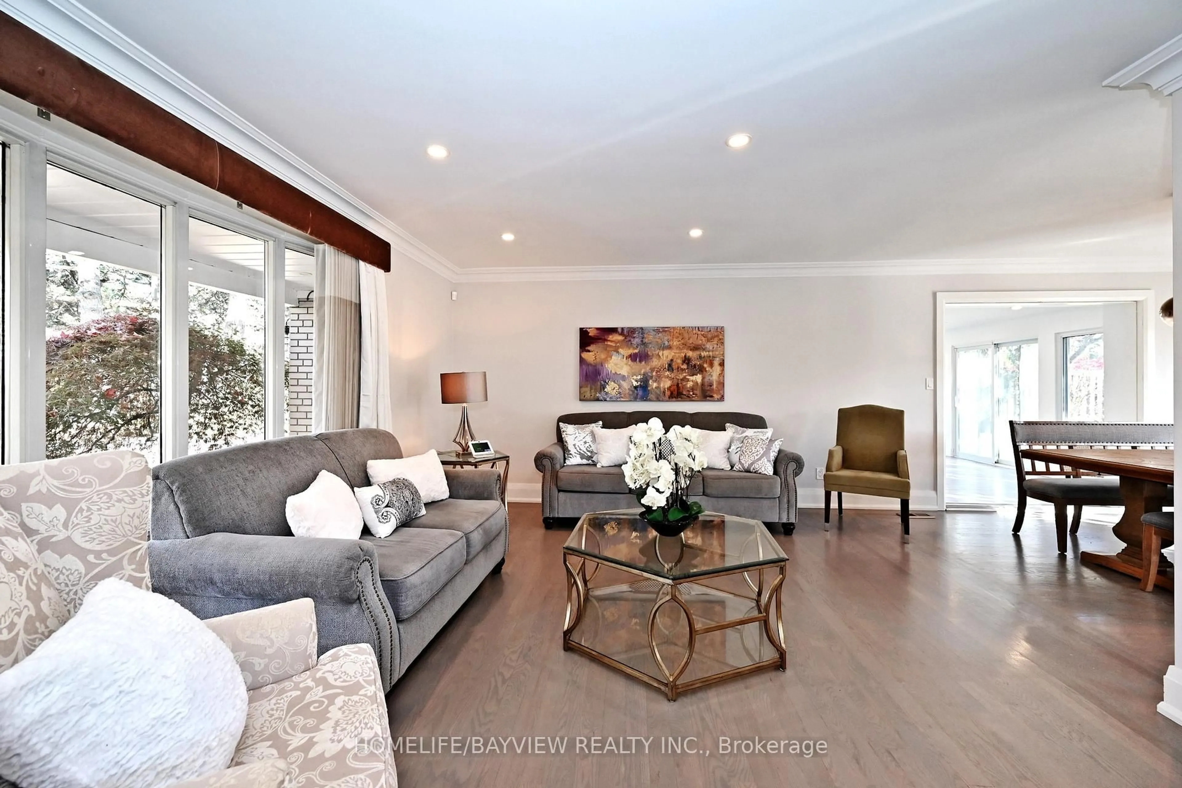 Living room with furniture, wood/laminate floor for 3 Wildrose Cres, Markham Ontario L3T 1N6