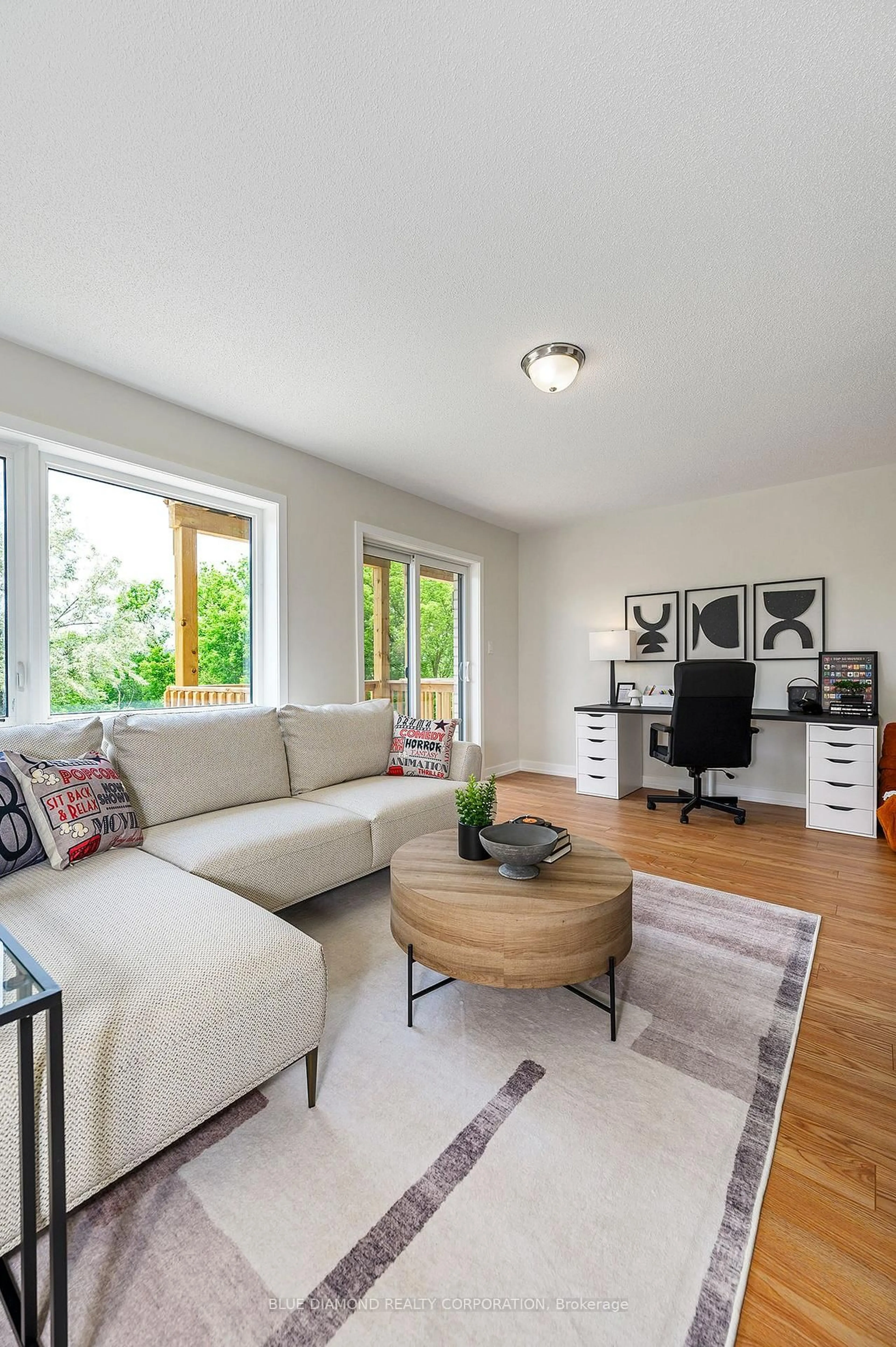 Living room with furniture, wood/laminate floor for 77 Flavelle Tr, Vaughan Ontario L4L 0M6