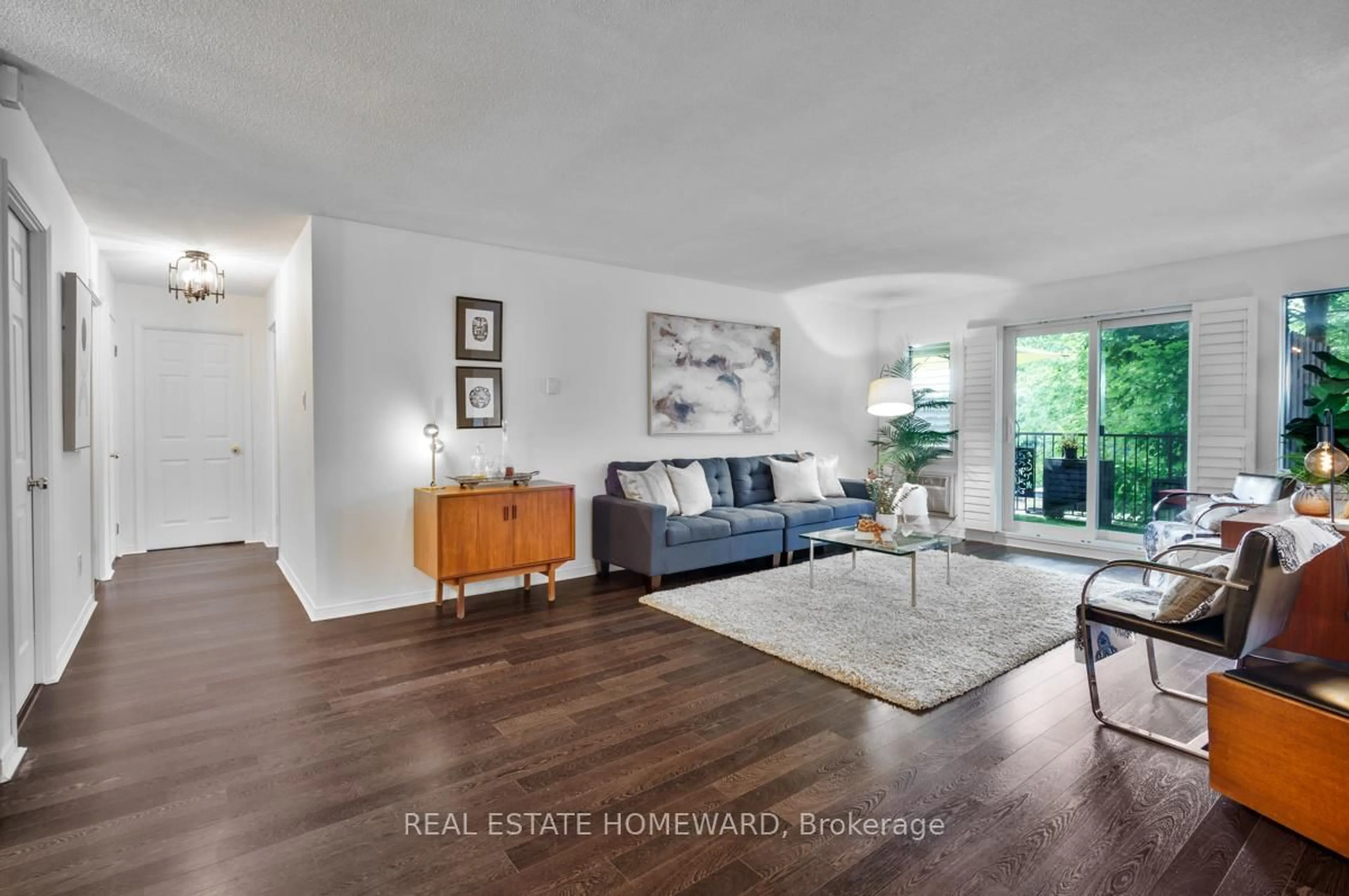 Living room with furniture, wood/laminate floor for 111 Grew Blvd #208, Georgina Ontario L0E 1L0