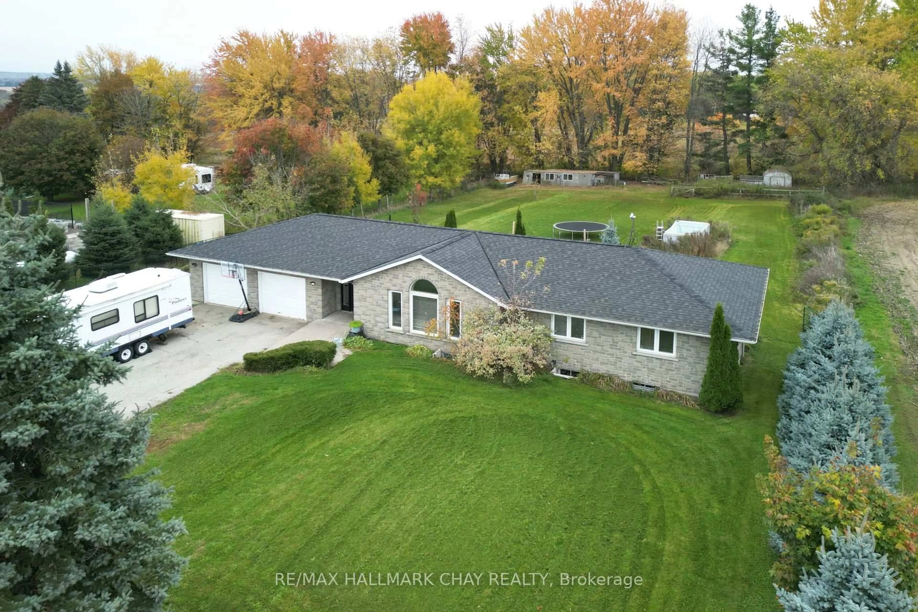 A pic from outside/outdoor area/front of a property/back of a property/a pic from drone, unknown for 7067 5th Sideroad, New Tecumseth Ontario L9R 1V2