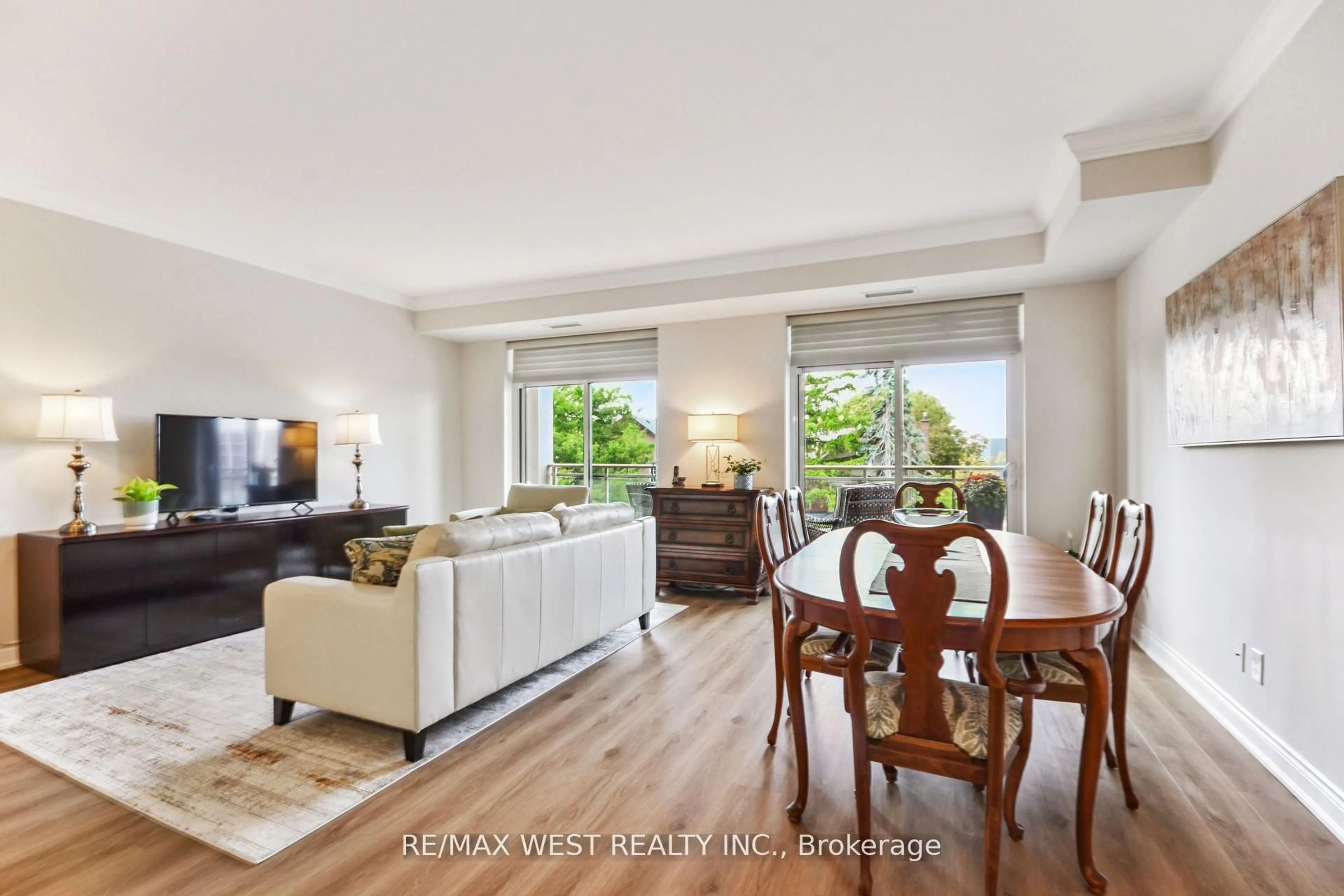 Living room with furniture, wood/laminate floor for 281 Woodbridge Ave #321, Vaughan Ontario L4L 0C6