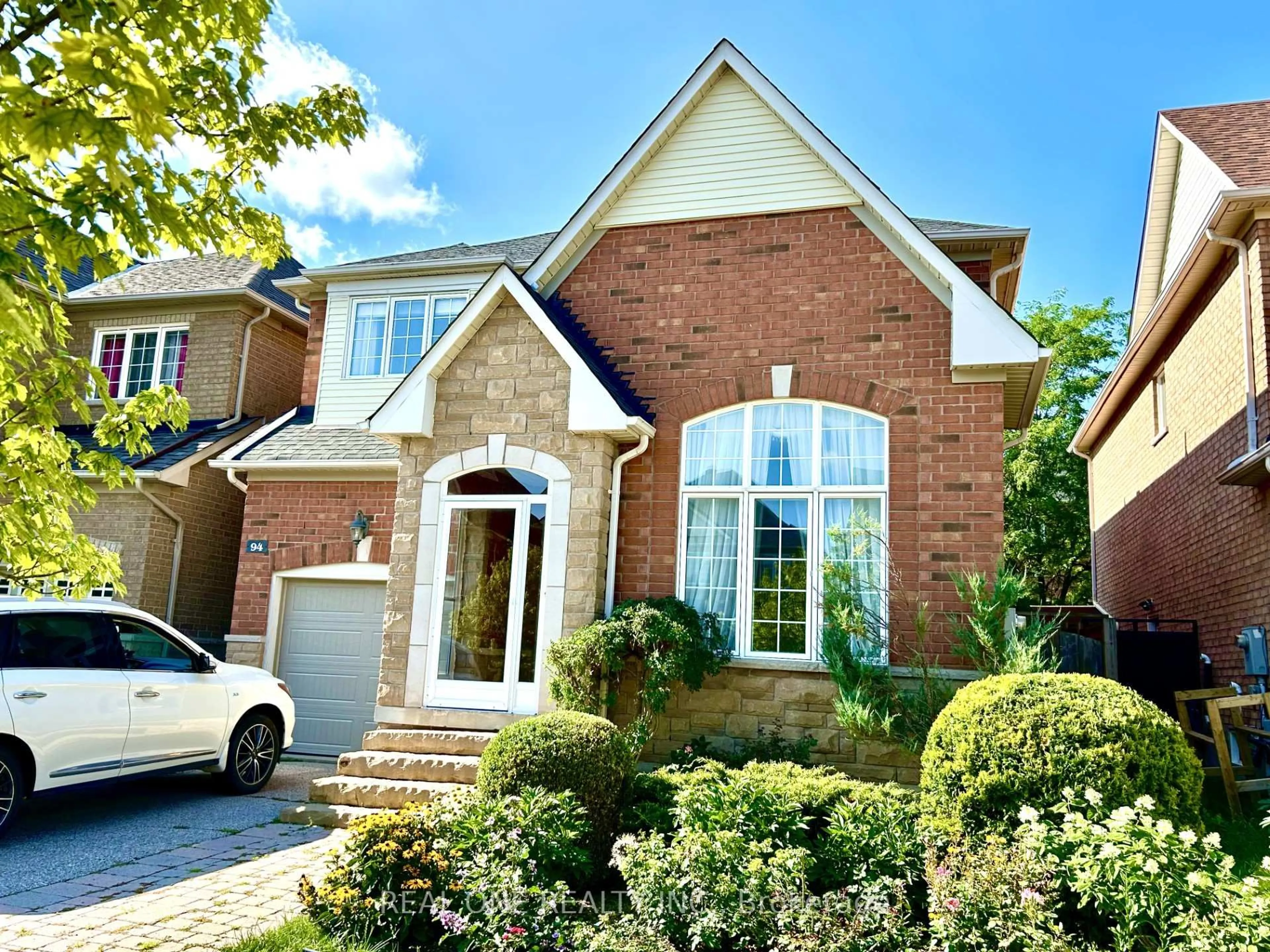 Home with brick exterior material, street for 94 Barnwood Dr, Richmond Hill Ontario L4E 5A2