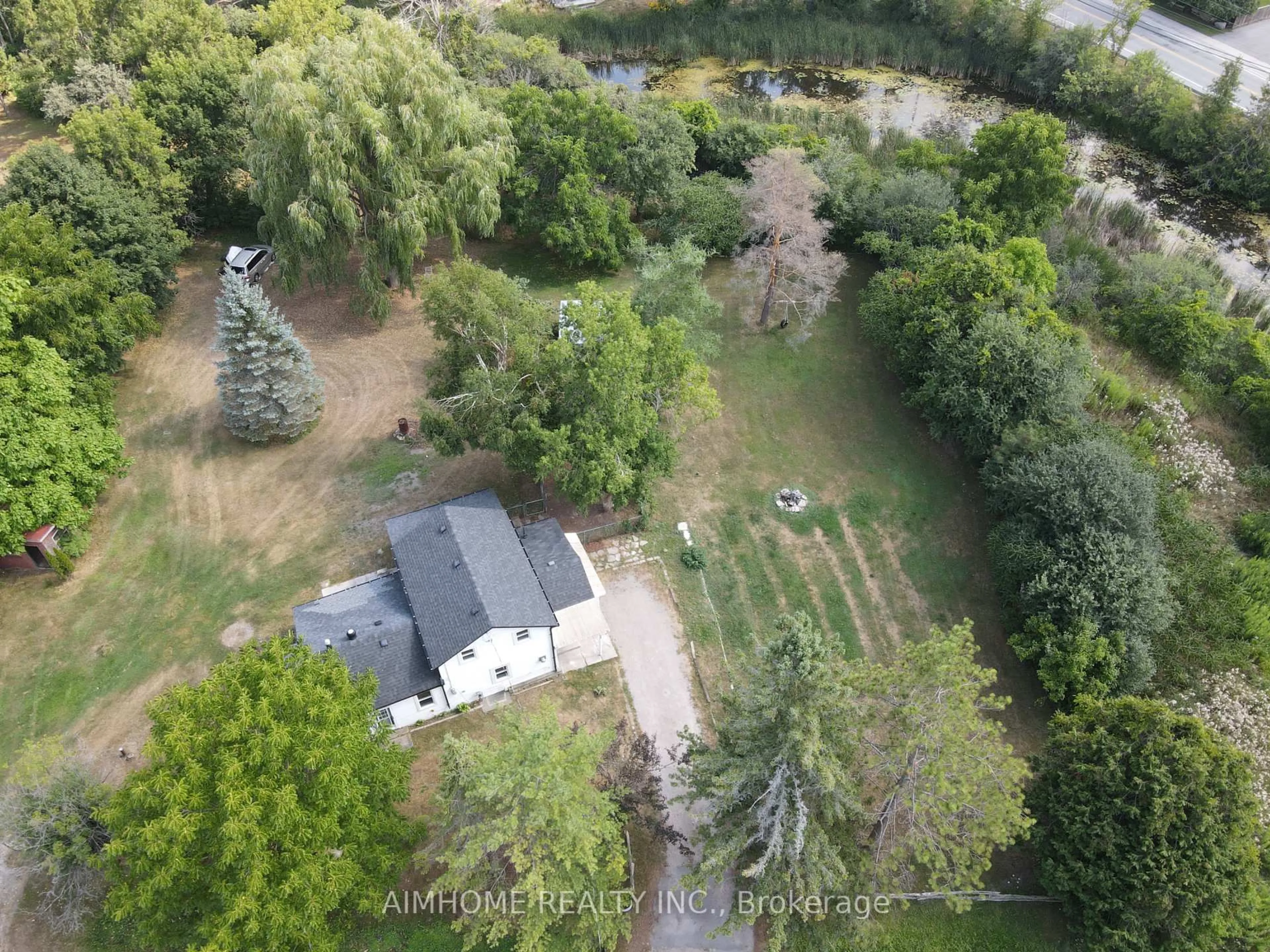 A pic from outside/outdoor area/front of a property/back of a property/a pic from drone, forest/trees view for 15 Main St, Georgina Ontario L0E 1N0