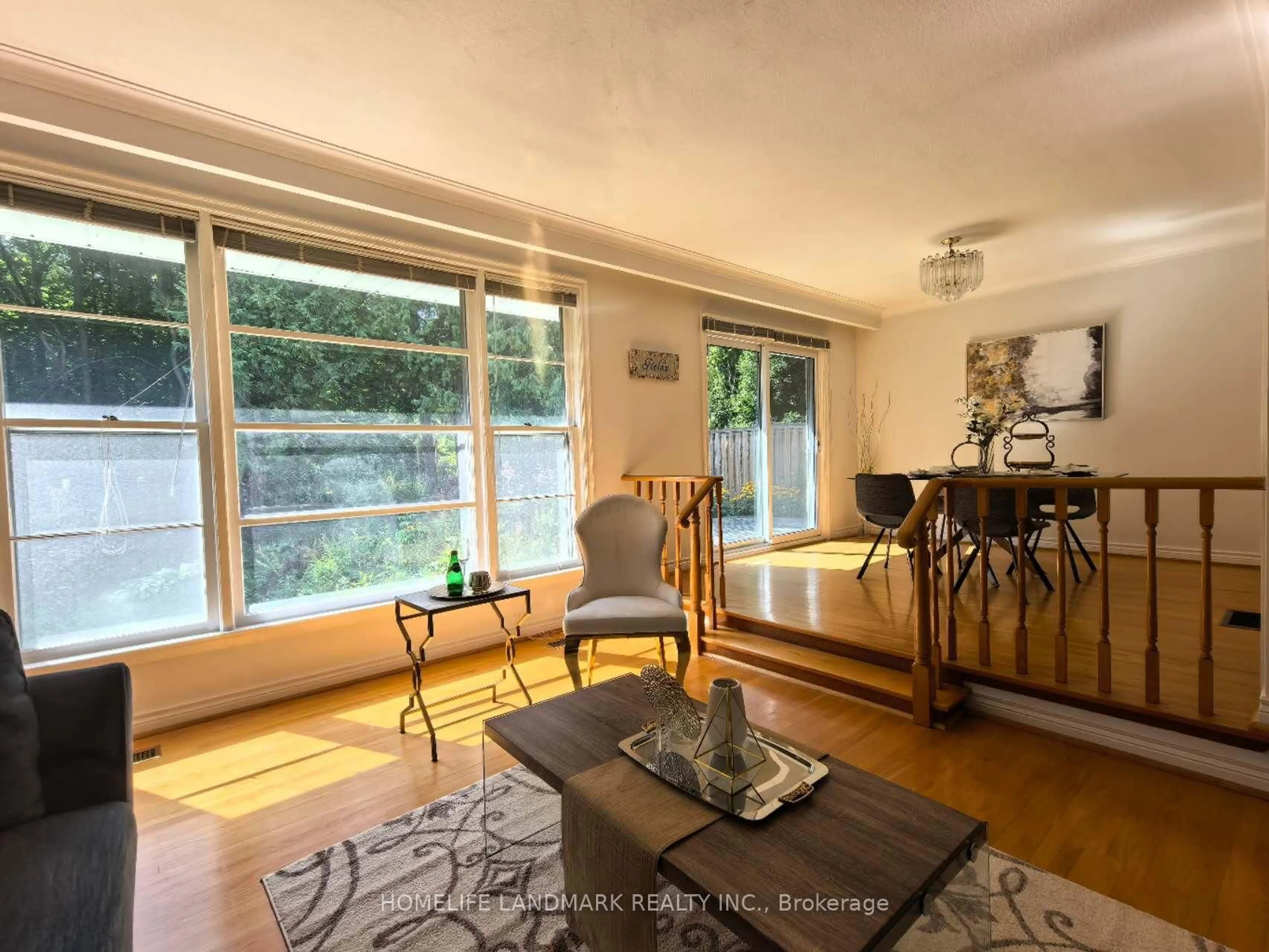 Living room with furniture, wood/laminate floor for 11 Drakefield Rd, Markham Ontario L3P 1G6