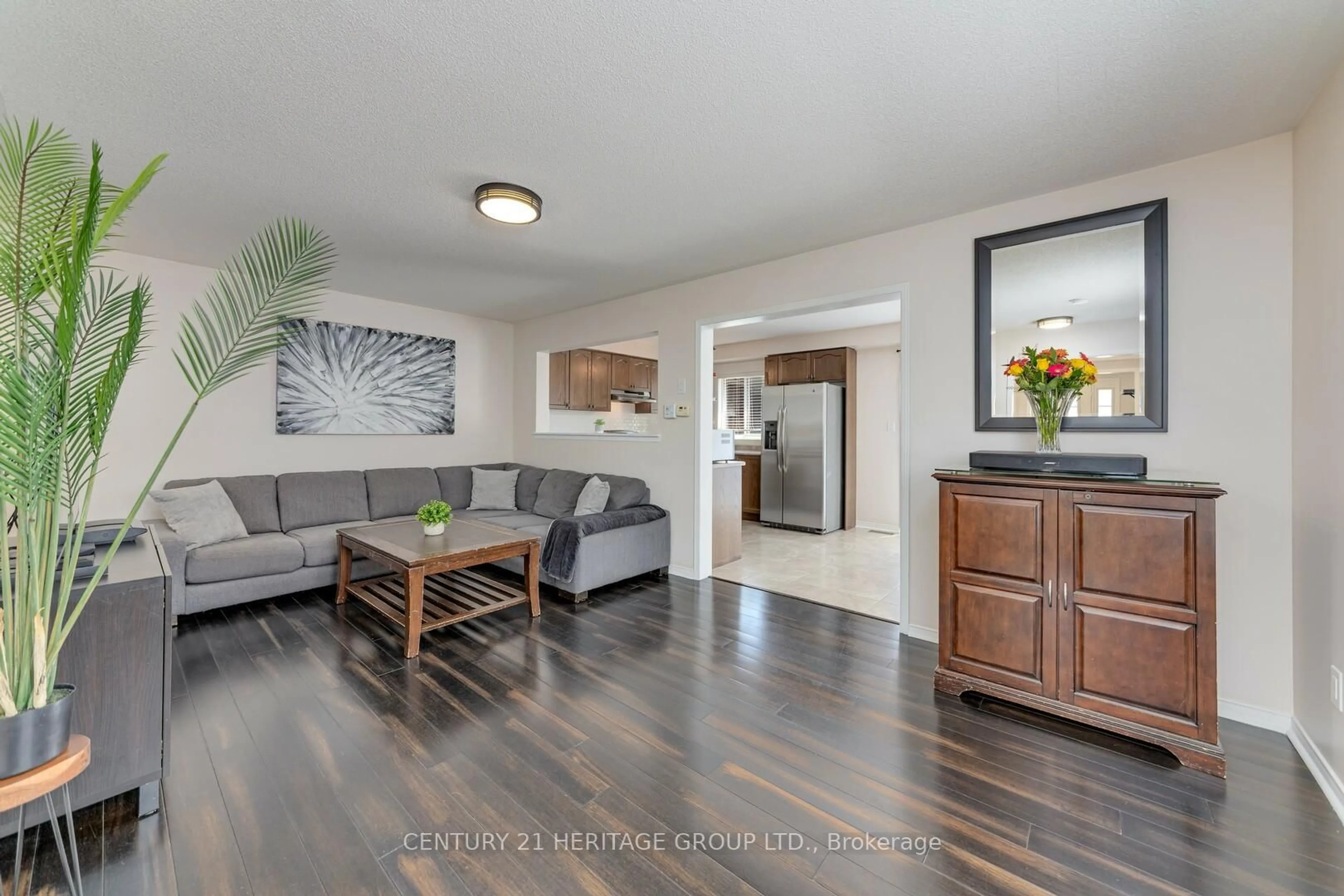 Living room with furniture, wood/laminate floor for 735 Miller Park Ave, Bradford West Gwillimbury Ontario L3Z 0L8