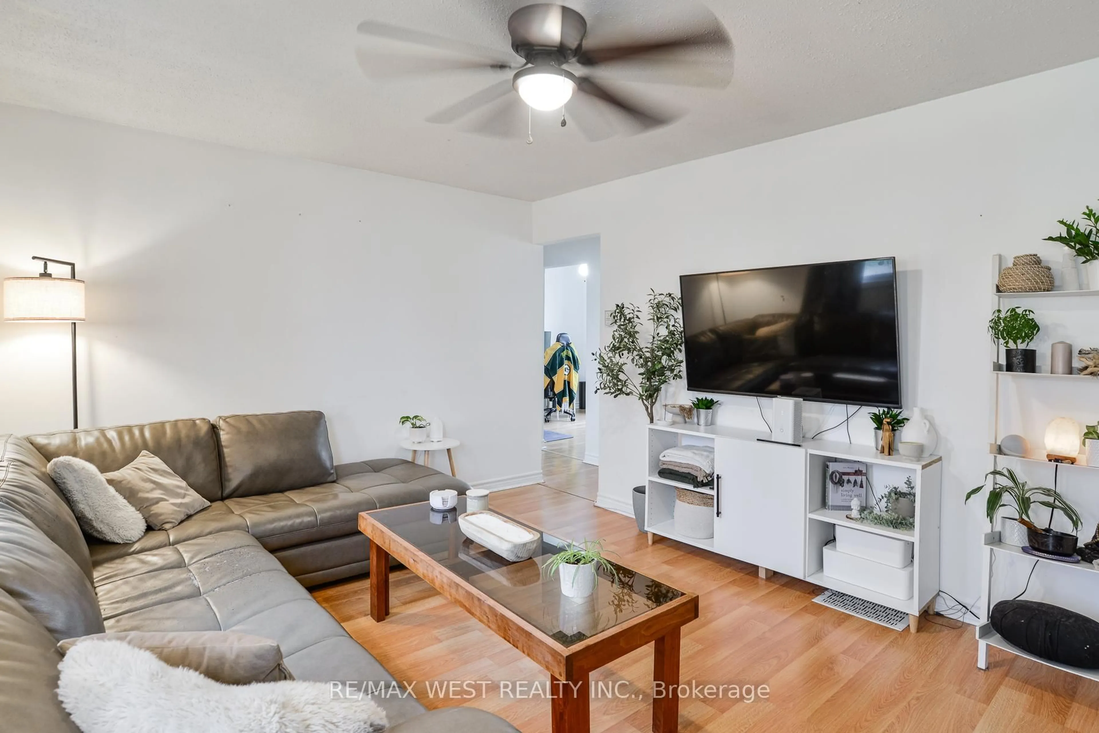 Living room with furniture, wood/laminate floor for 122 Raglan St, Essa Ontario L0M 1B0