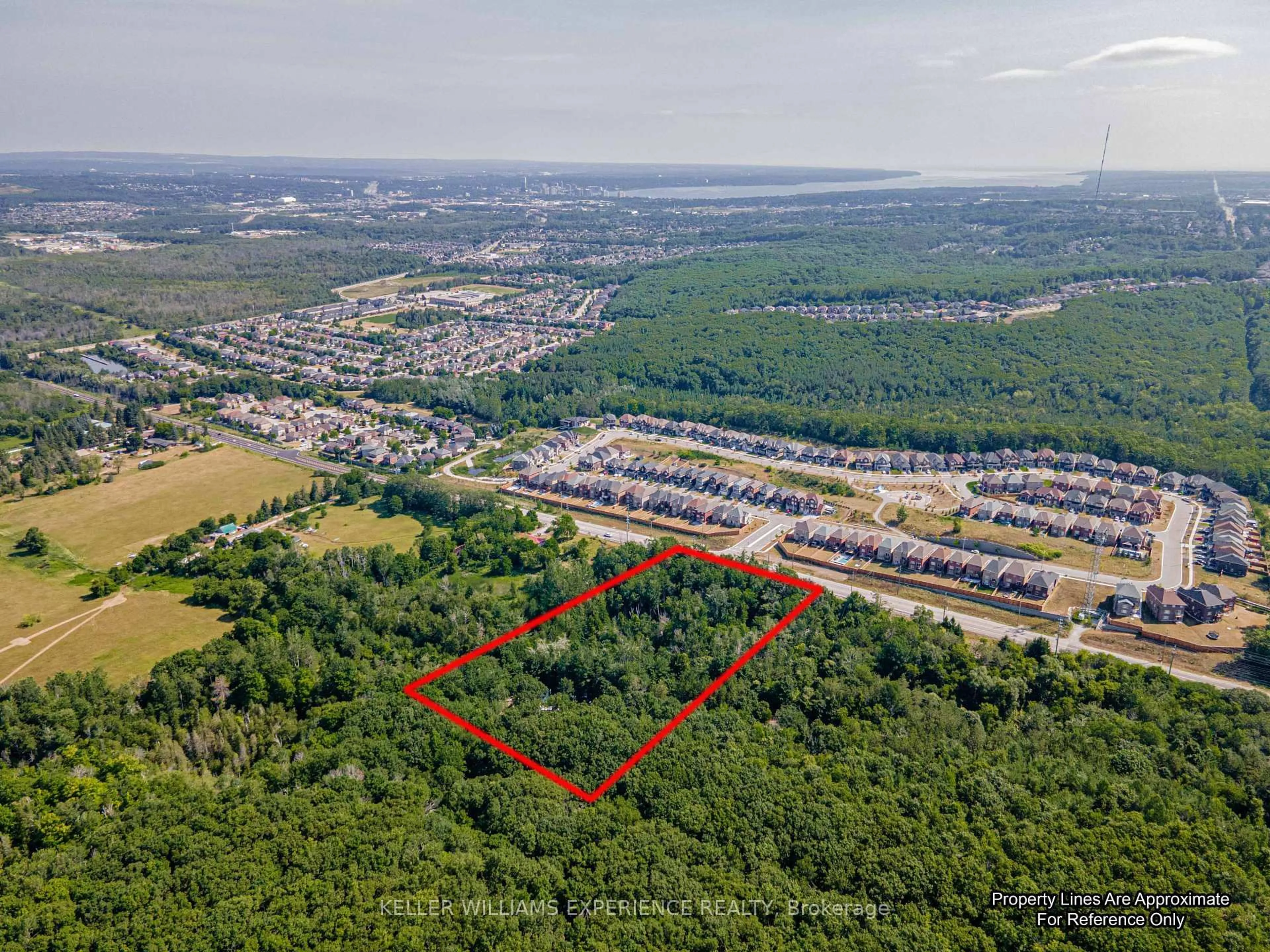 A pic from outside/outdoor area/front of a property/back of a property/a pic from drone, forest/trees view for 8294 County 27 Rd, Essa Ontario L4N 9C4