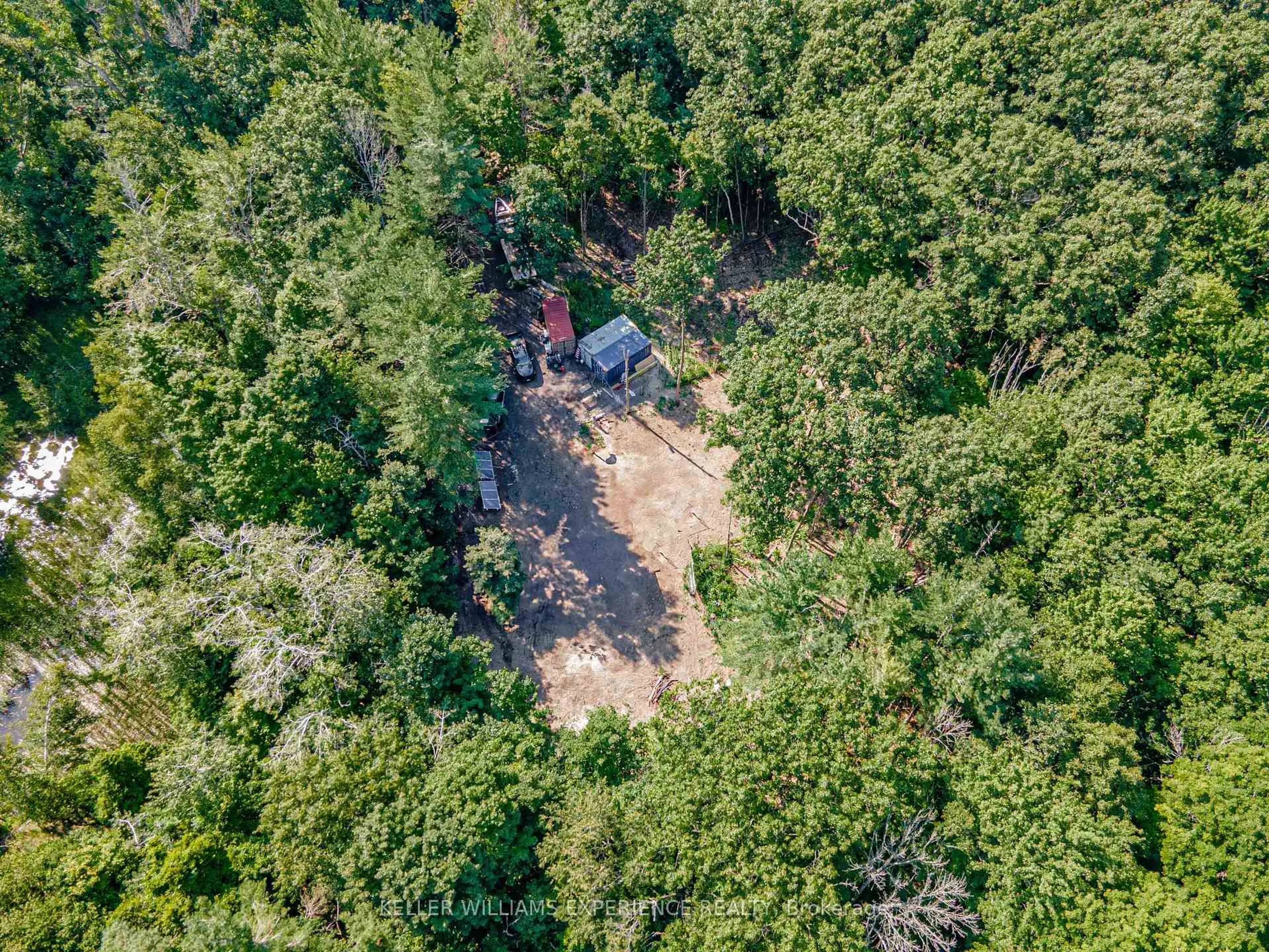 A pic from outside/outdoor area/front of a property/back of a property/a pic from drone, forest/trees view for 8294 County 27 Rd, Essa Ontario L4N 9C4