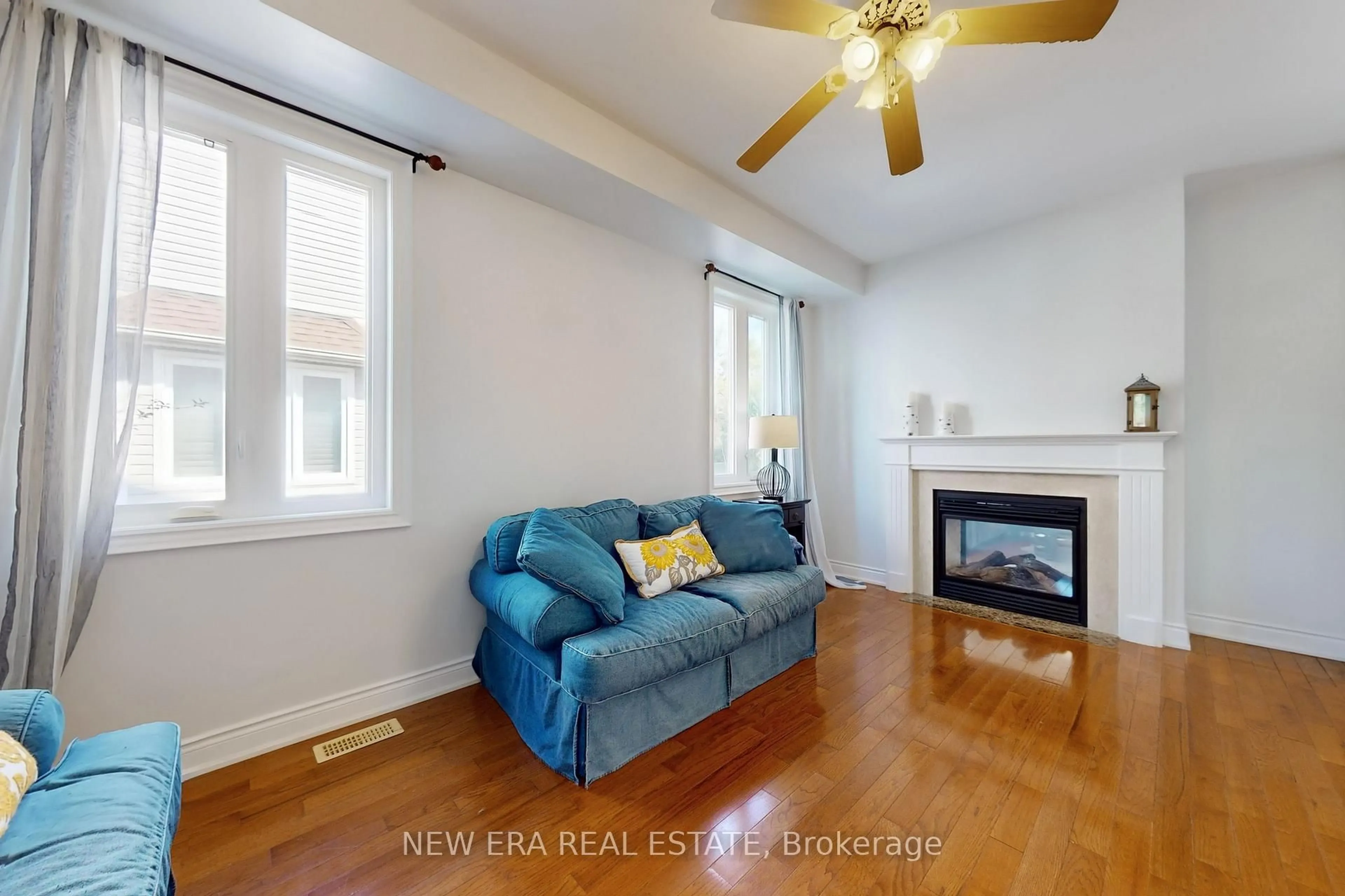 Living room with furniture, wood/laminate floor for 1031 Lake Dr, Georgina Ontario L4P 3E9