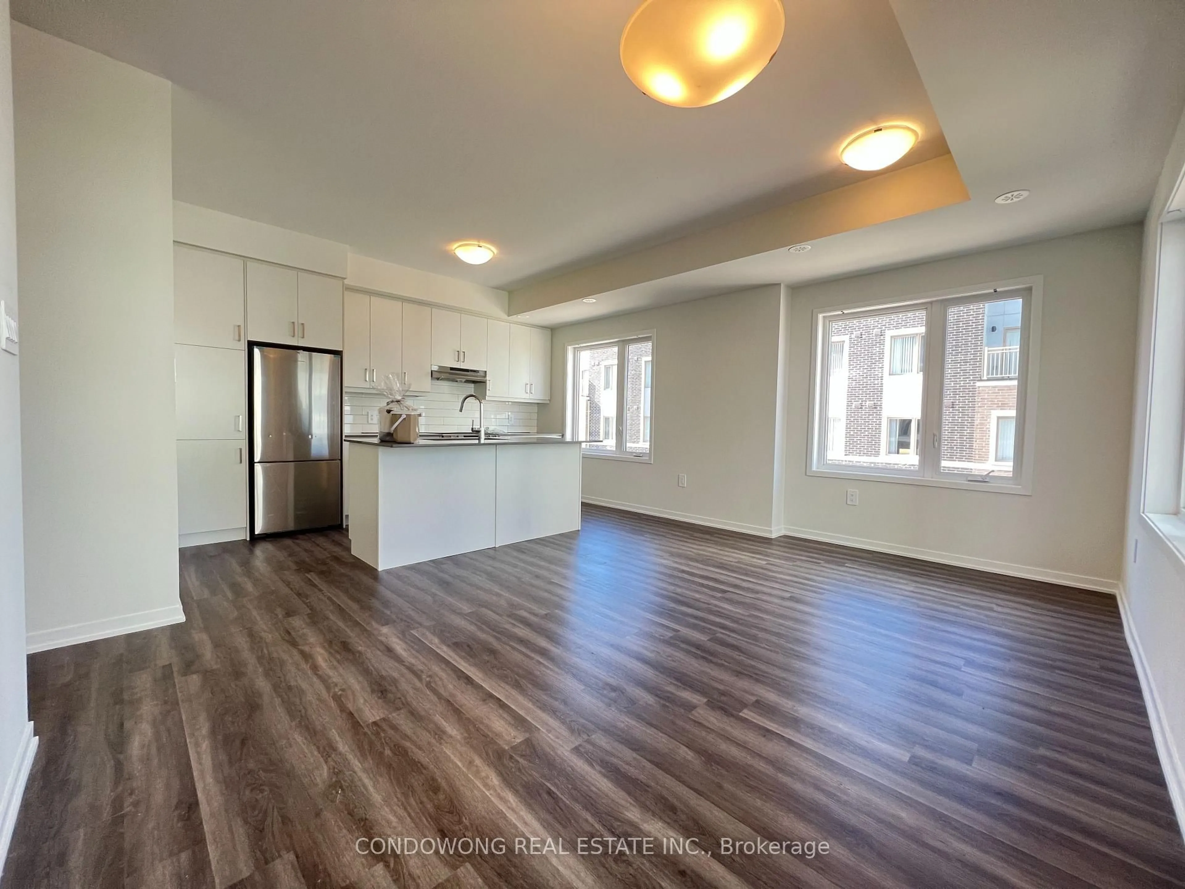Open concept kitchen, wood/laminate floor for 31 Honeycrisp Cres #49, Vaughan Ontario L4K 0N6