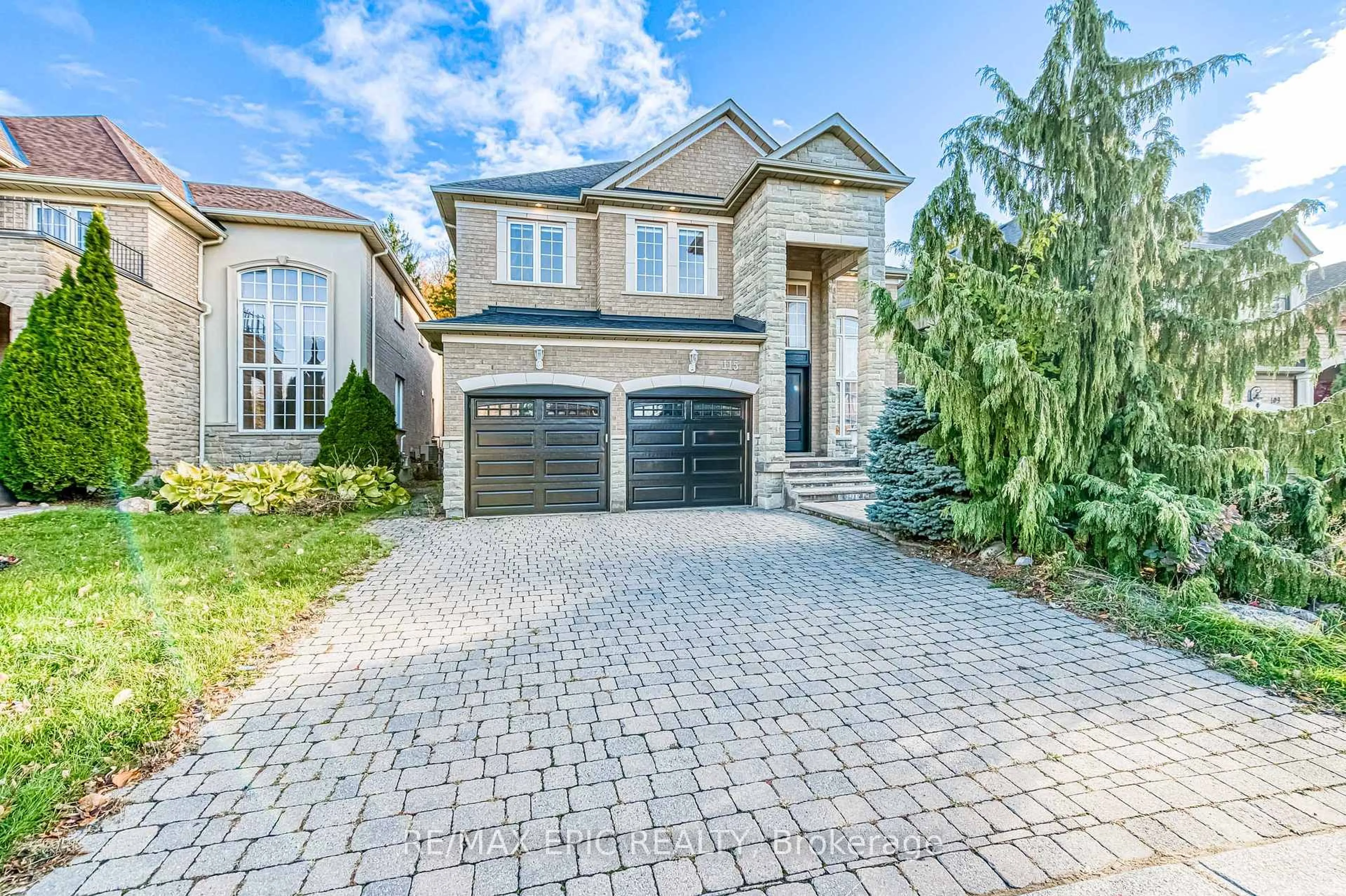 Home with brick exterior material, street for 115 Thornhill Woods Dr, Vaughan Ontario L4J 8R5