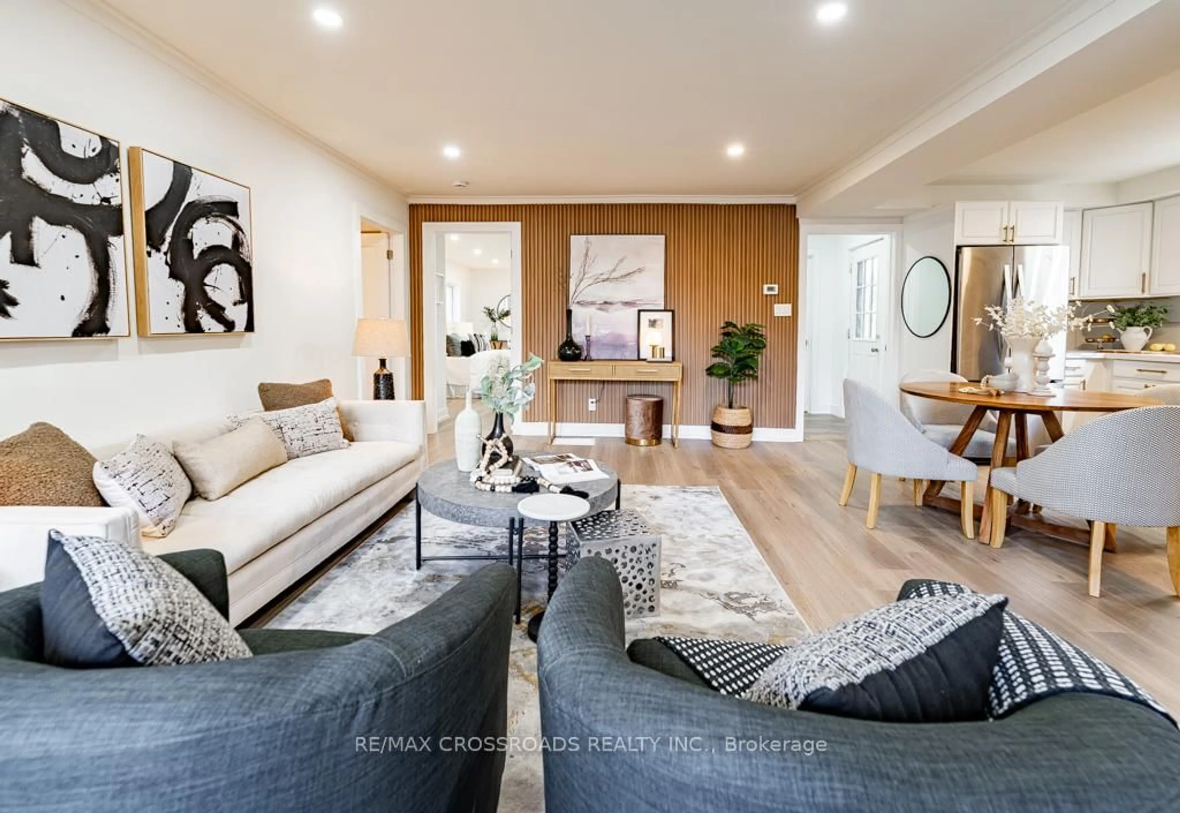 Living room with furniture, wood/laminate floor for 267 Pine Beach Dr, Georgina Ontario L4P 2V7