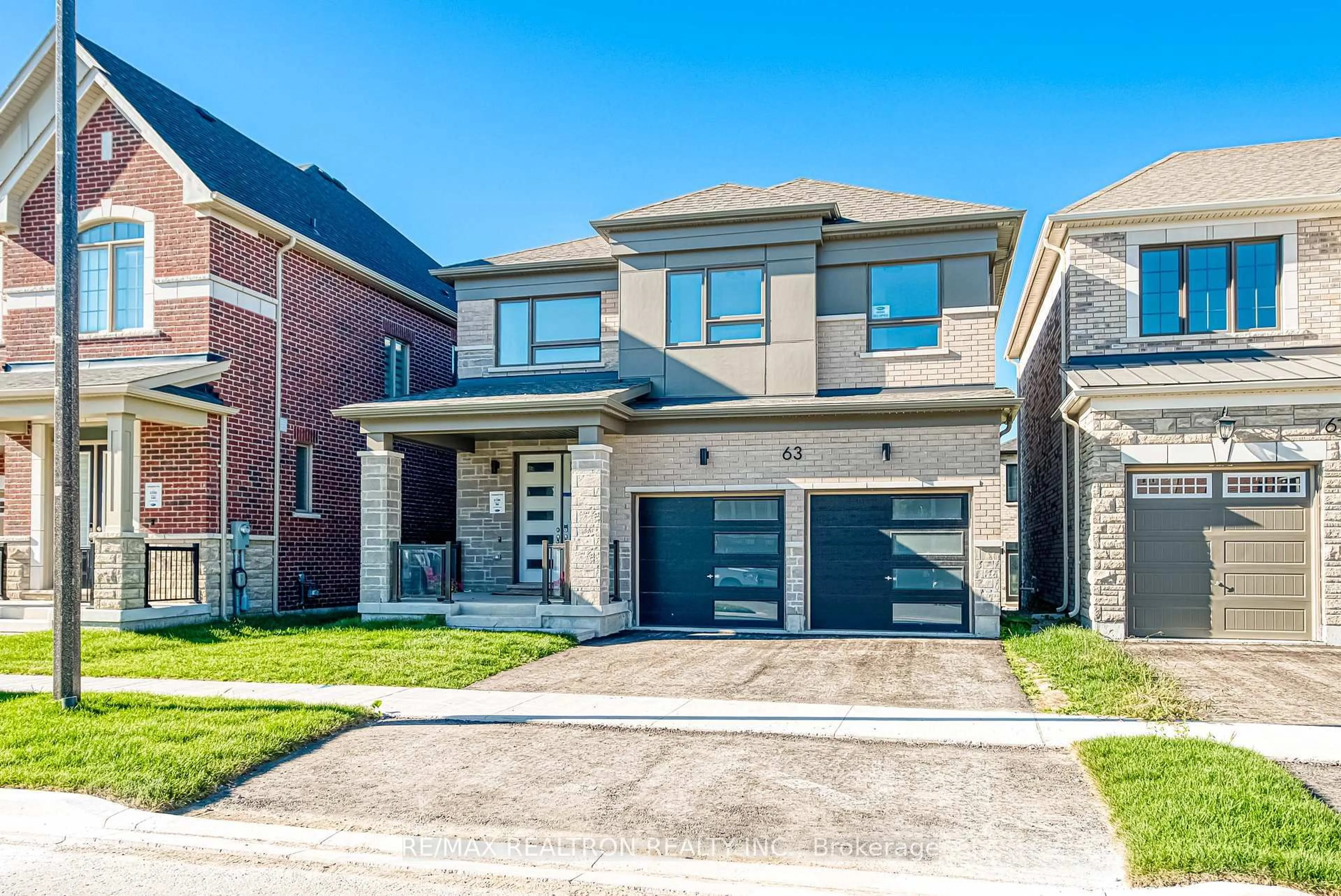 Home with brick exterior material, street for 63 Greenridge Cres, Markham Ontario L6C 3M1