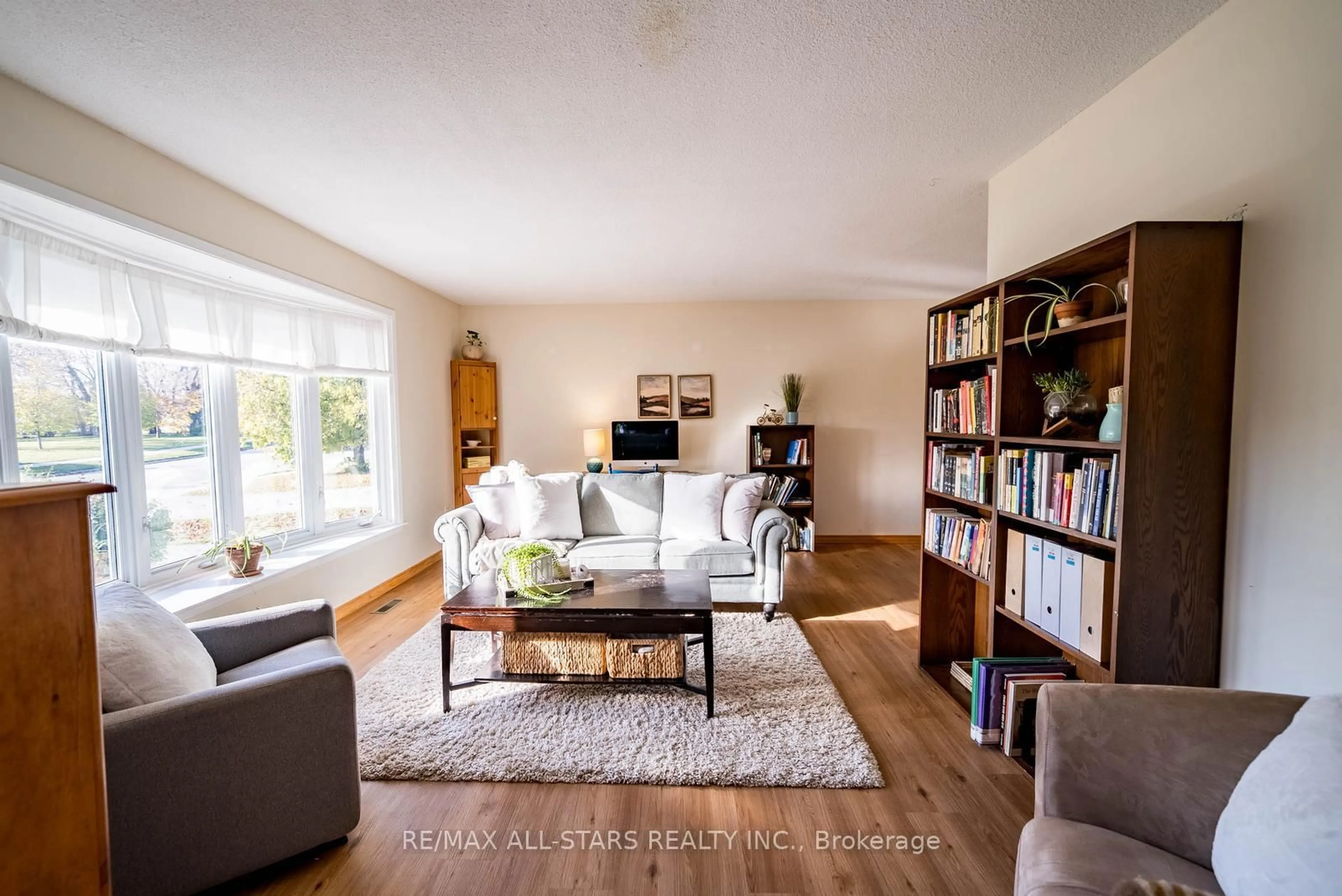 Living room with furniture, wood/laminate floor for 115 Stouffer St, Whitchurch-Stouffville Ontario L4A 6A3