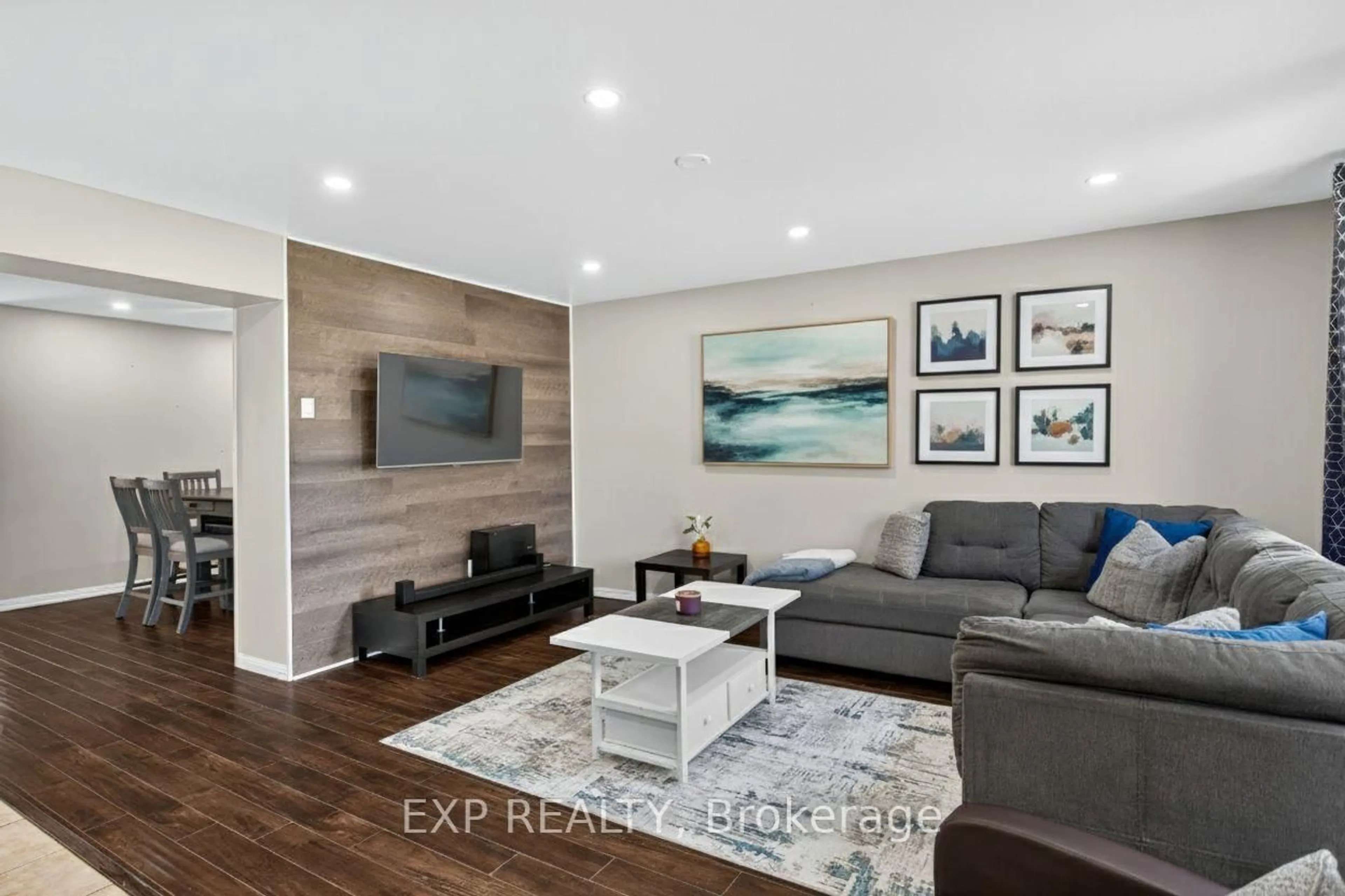 Living room with furniture, wood/laminate floor for 38 John W Taylor Ave, New Tecumseth Ontario L9R 0B6