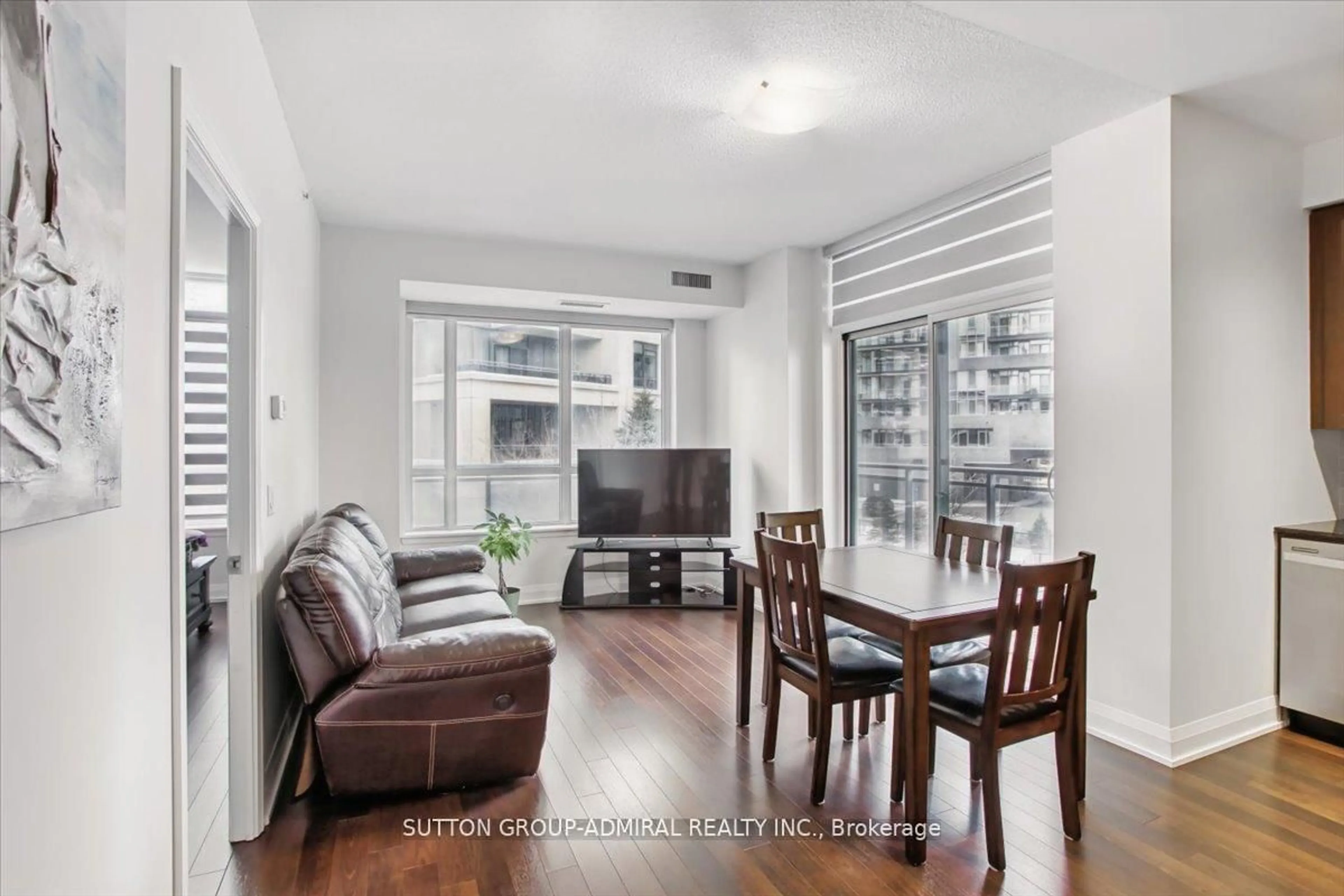 Living room with furniture, wood/laminate floor for 95 North Park Rd #204, Vaughan Ontario L4J 0J1