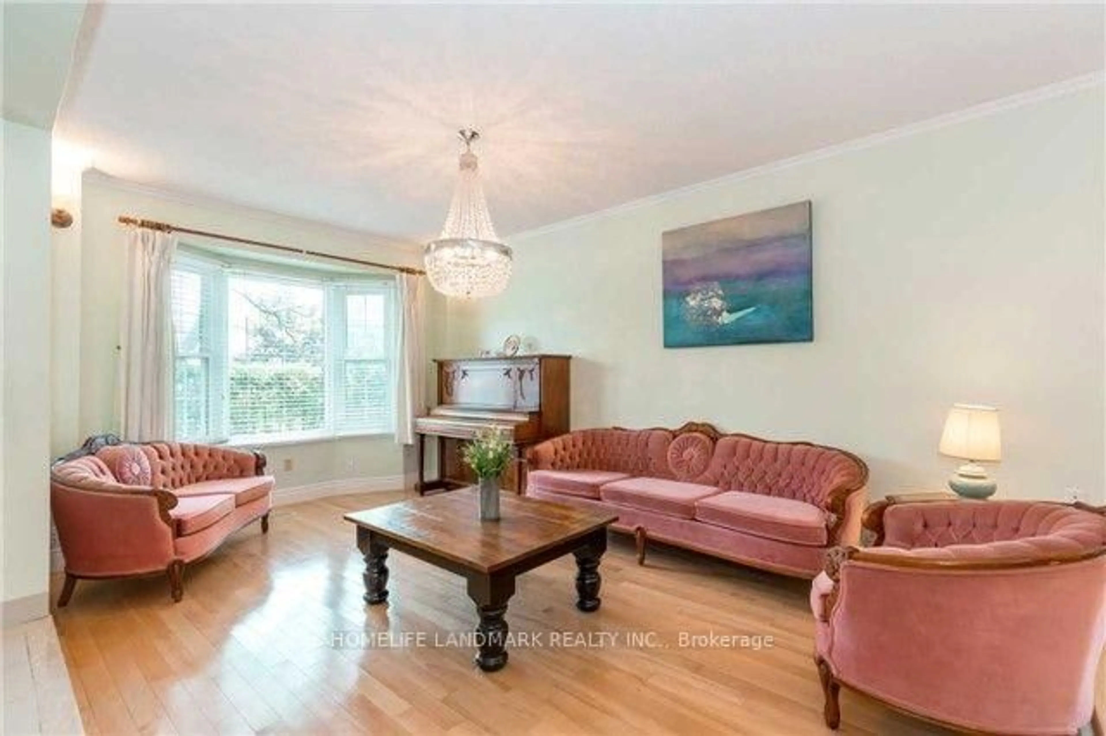 Living room with furniture, wood/laminate floor for 242 Raymerville Dr, Markham Ontario L3P 6S1