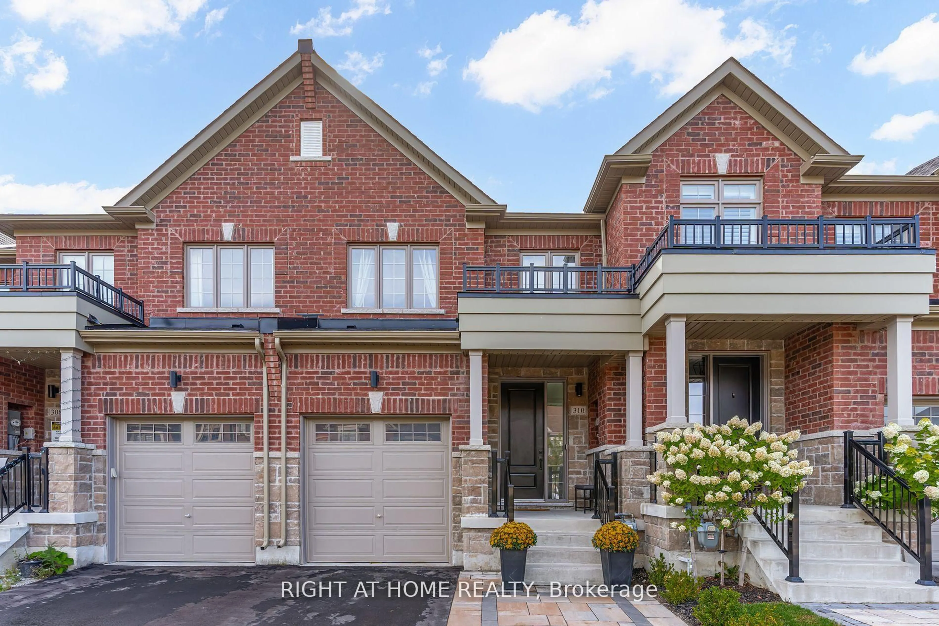 Home with brick exterior material, street for 310 Silk Twist Dr, East Gwillimbury Ontario L9N 0V4