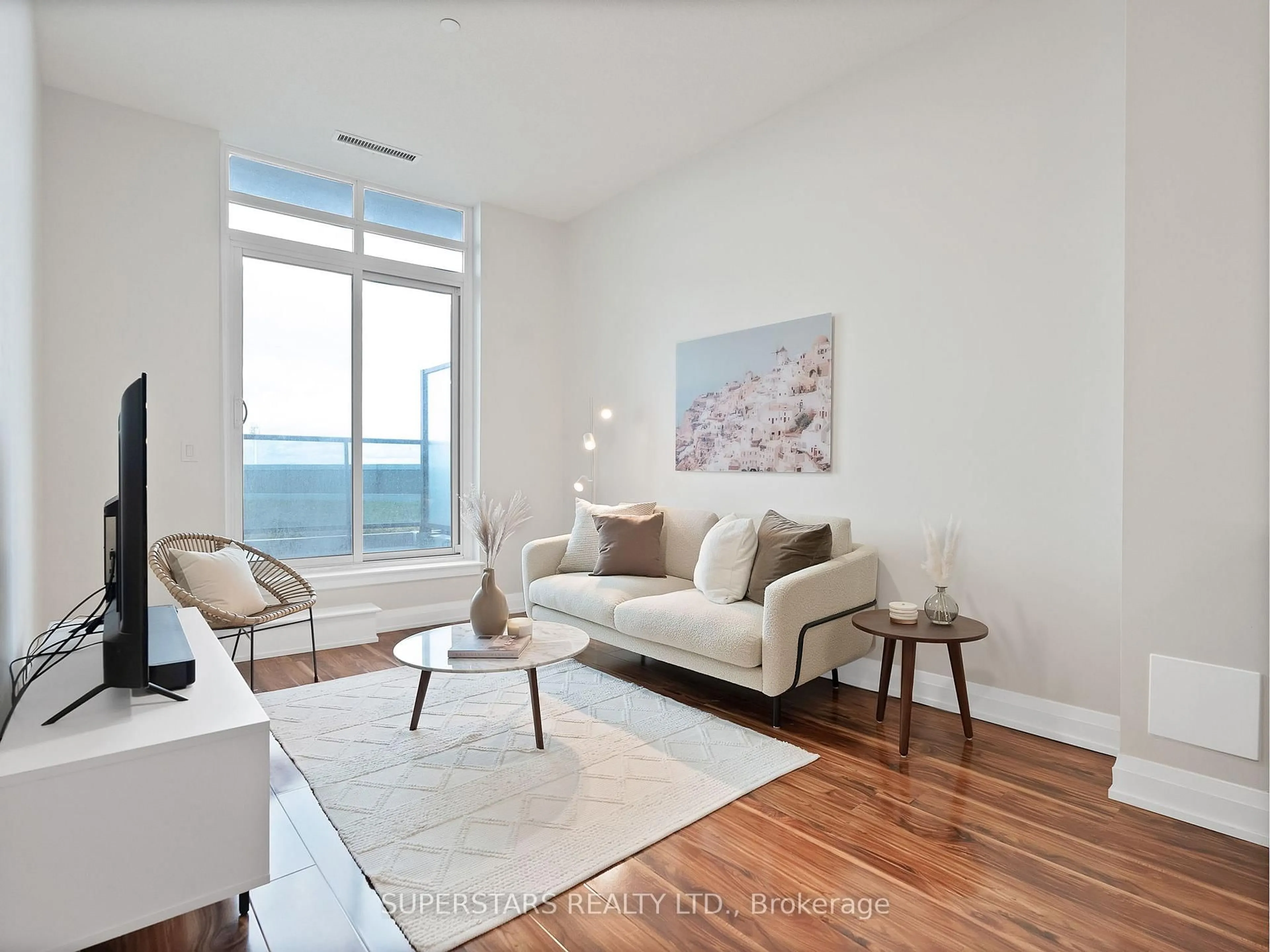 Living room with furniture, wood/laminate floor for 7171 Yonge St #303, Markham Ontario L3T 0C5