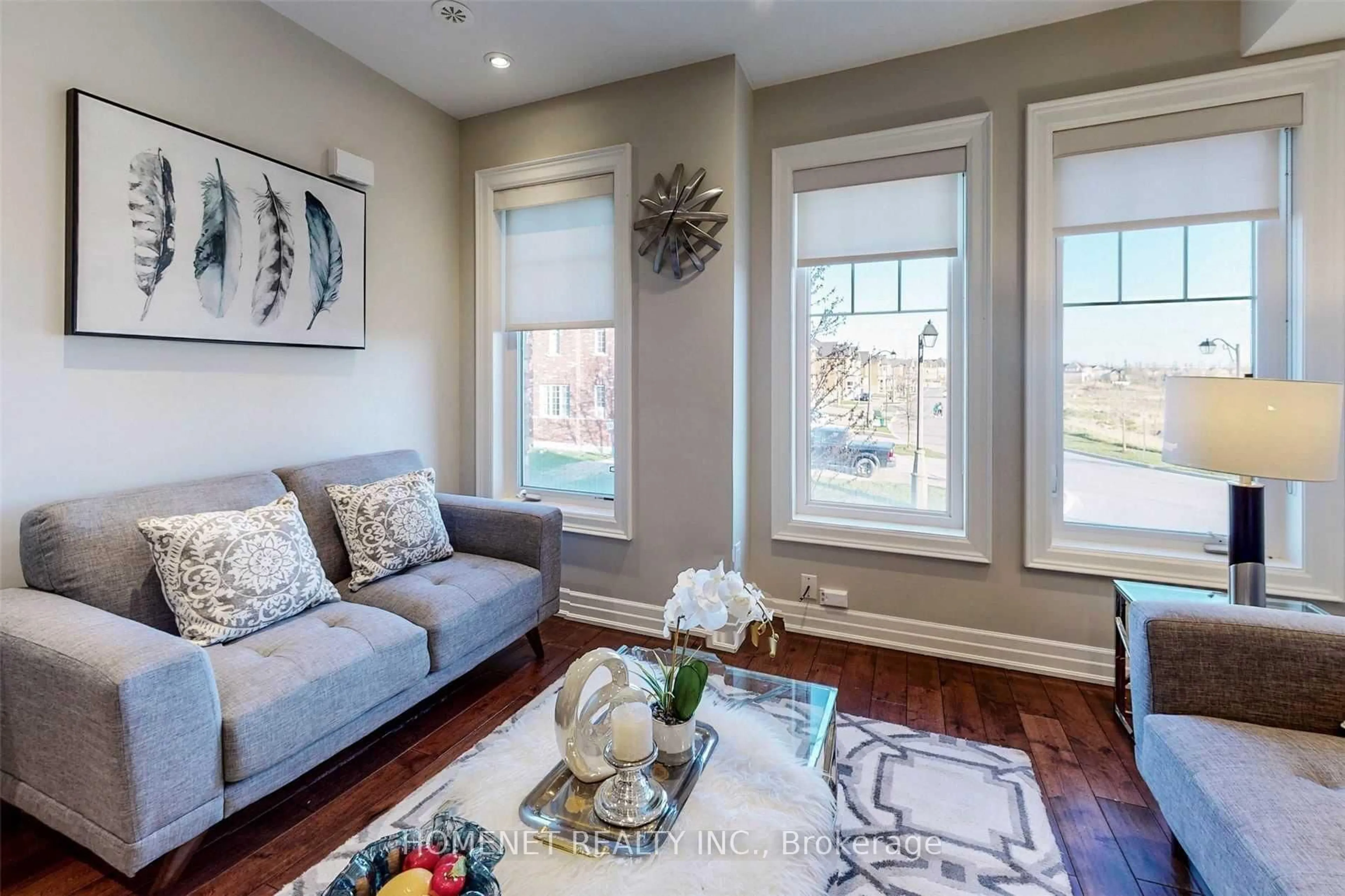 Living room with furniture, wood/laminate floor for 14 Truchard Ave, Markham Ontario L6C 0N3