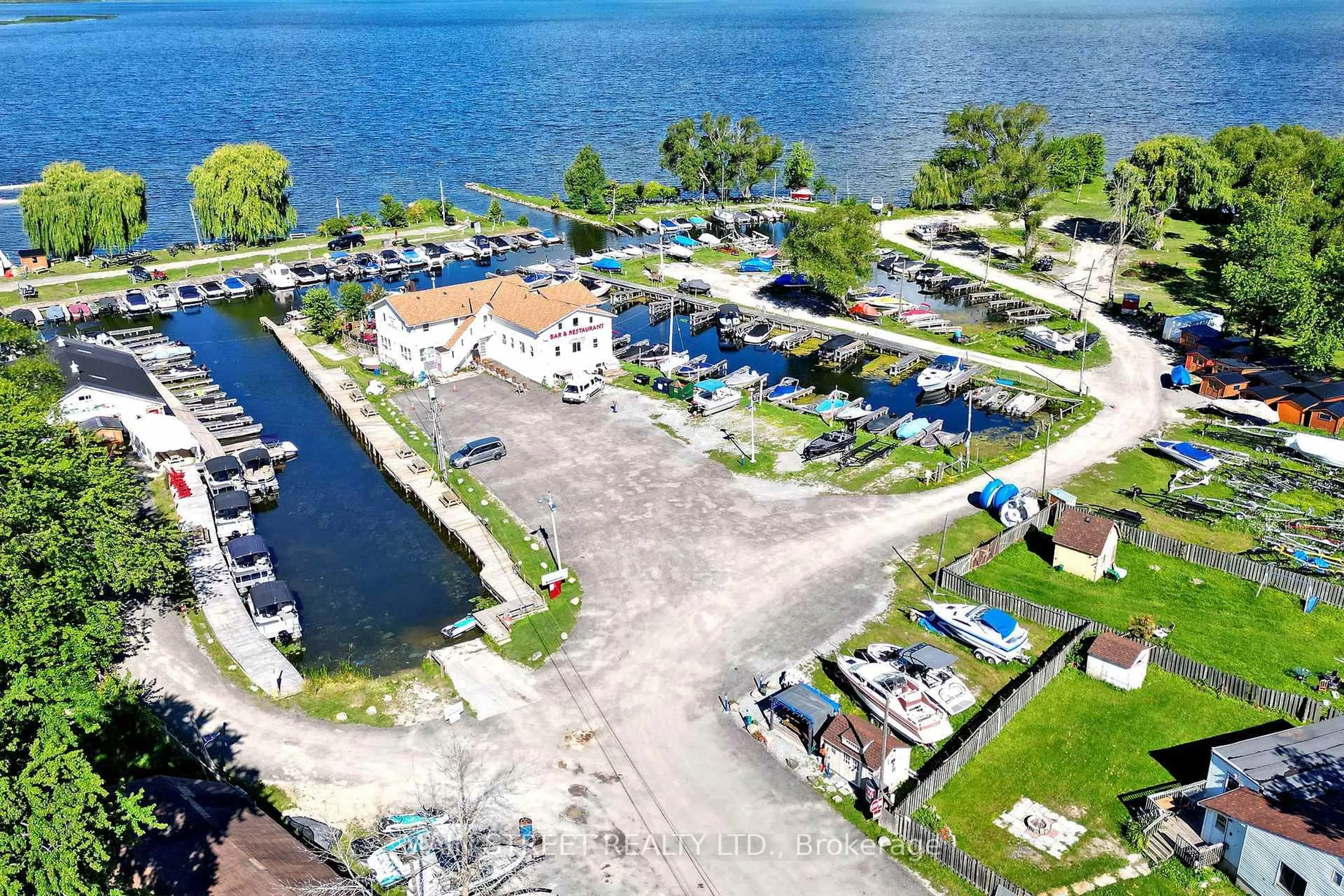 A pic from outside/outdoor area/front of a property/back of a property/a pic from drone, water/lake/river/ocean view for 350 Miami Dr, Georgina Ontario L4P 2Z7