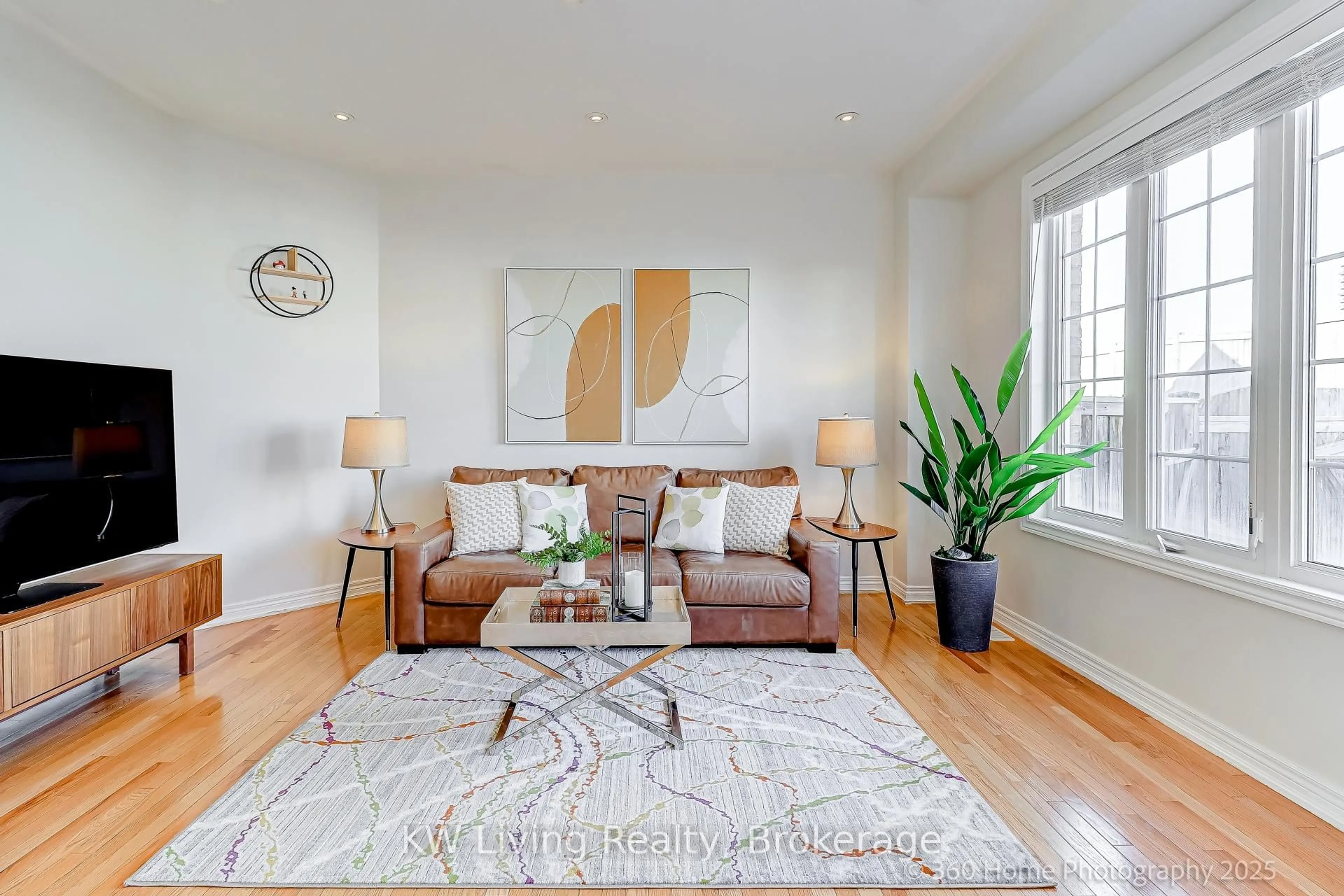 Living room with furniture, wood/laminate floor for 157 Hammersly Blvd, Markham Ontario L6E 0K8