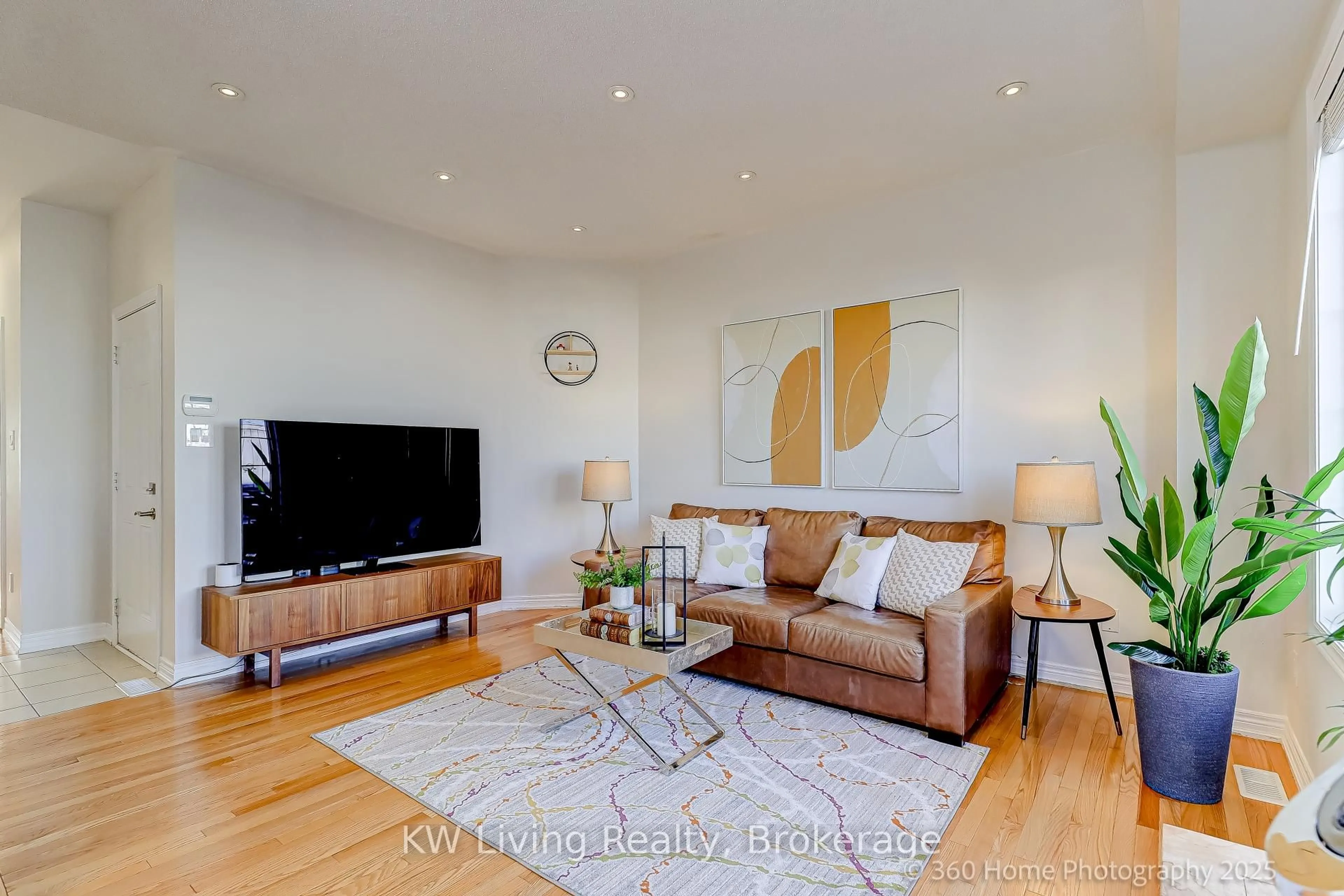 Living room with furniture, wood/laminate floor for 157 Hammersly Blvd, Markham Ontario L6E 0K8