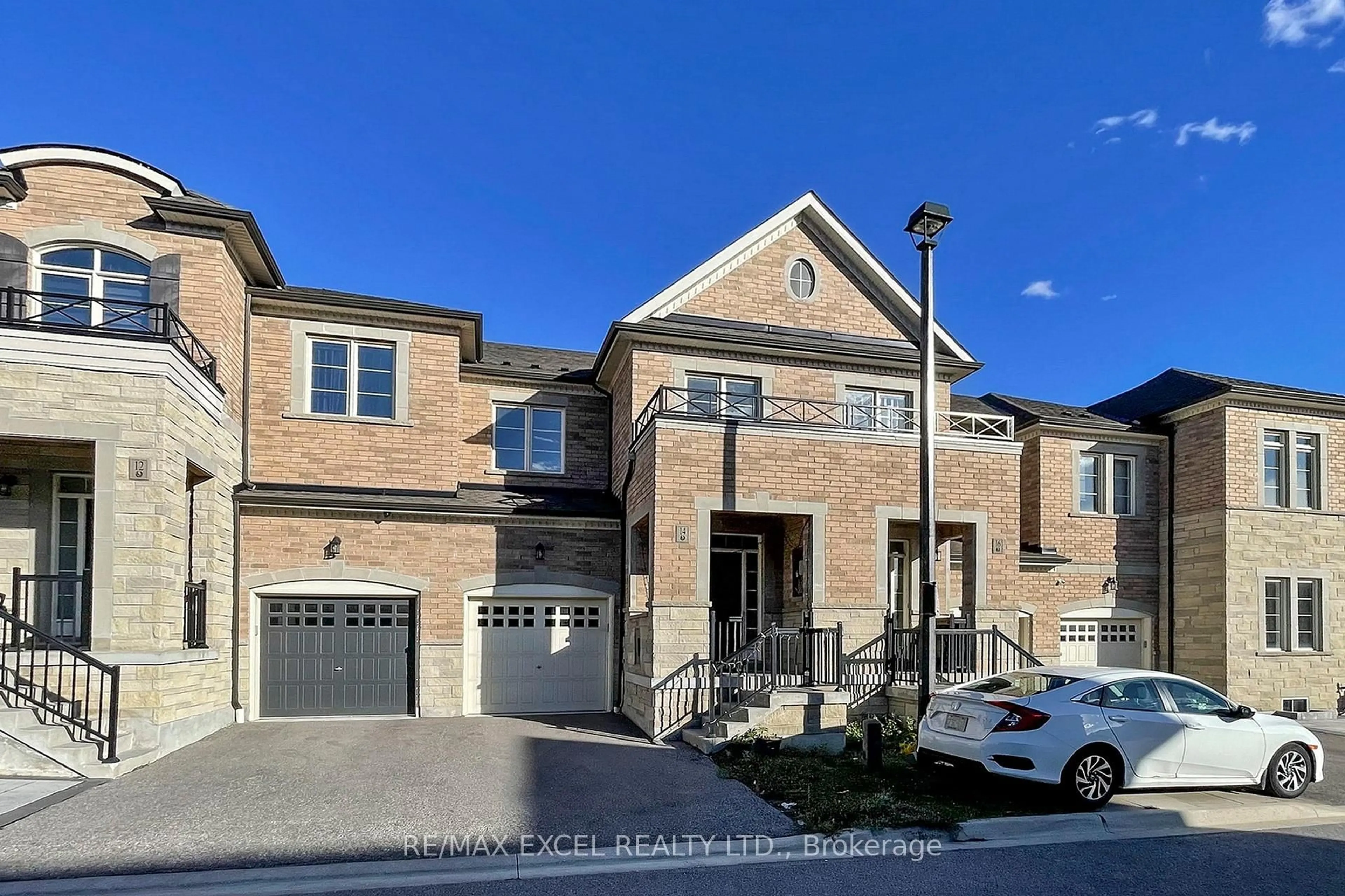 Home with brick exterior material, street for 14 TWINFLOWER Lane, Richmond Hill Ontario L4E 1E7