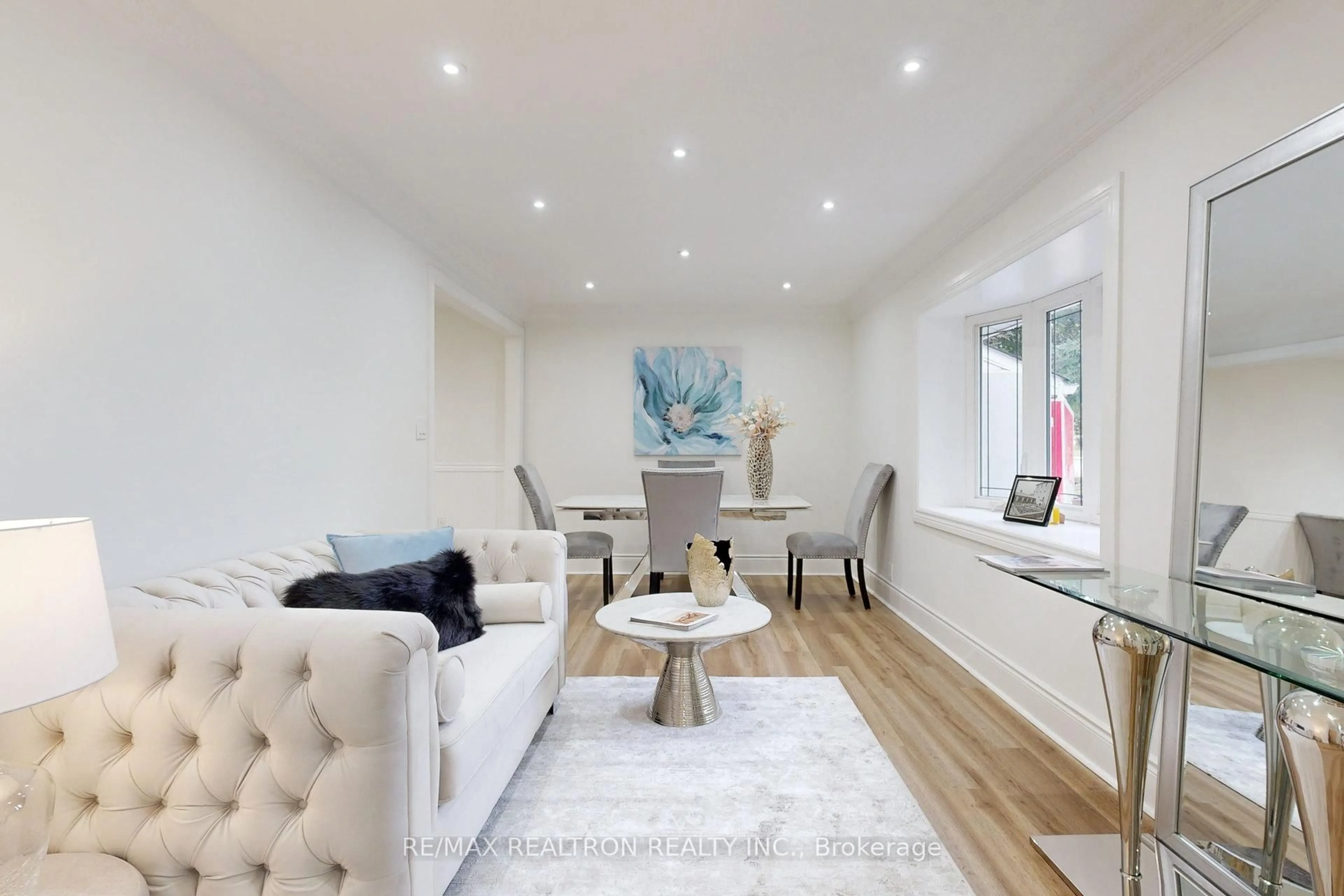 Living room with furniture, wood/laminate floor for 56 Don Mor Dr, Newmarket Ontario L3Y 1G7