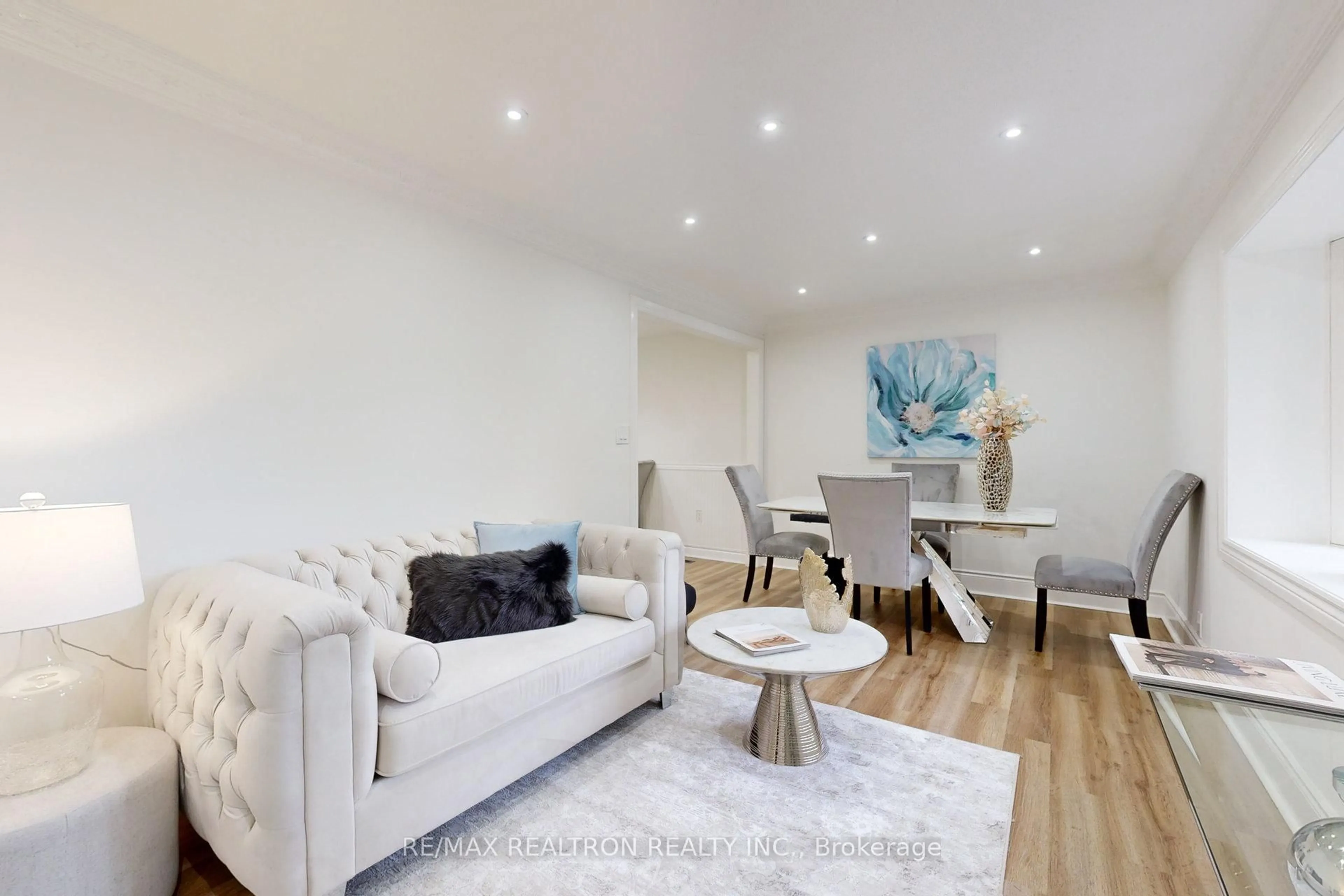 Living room with furniture, wood/laminate floor for 56 Don Mor Dr, Newmarket Ontario L3Y 1G7