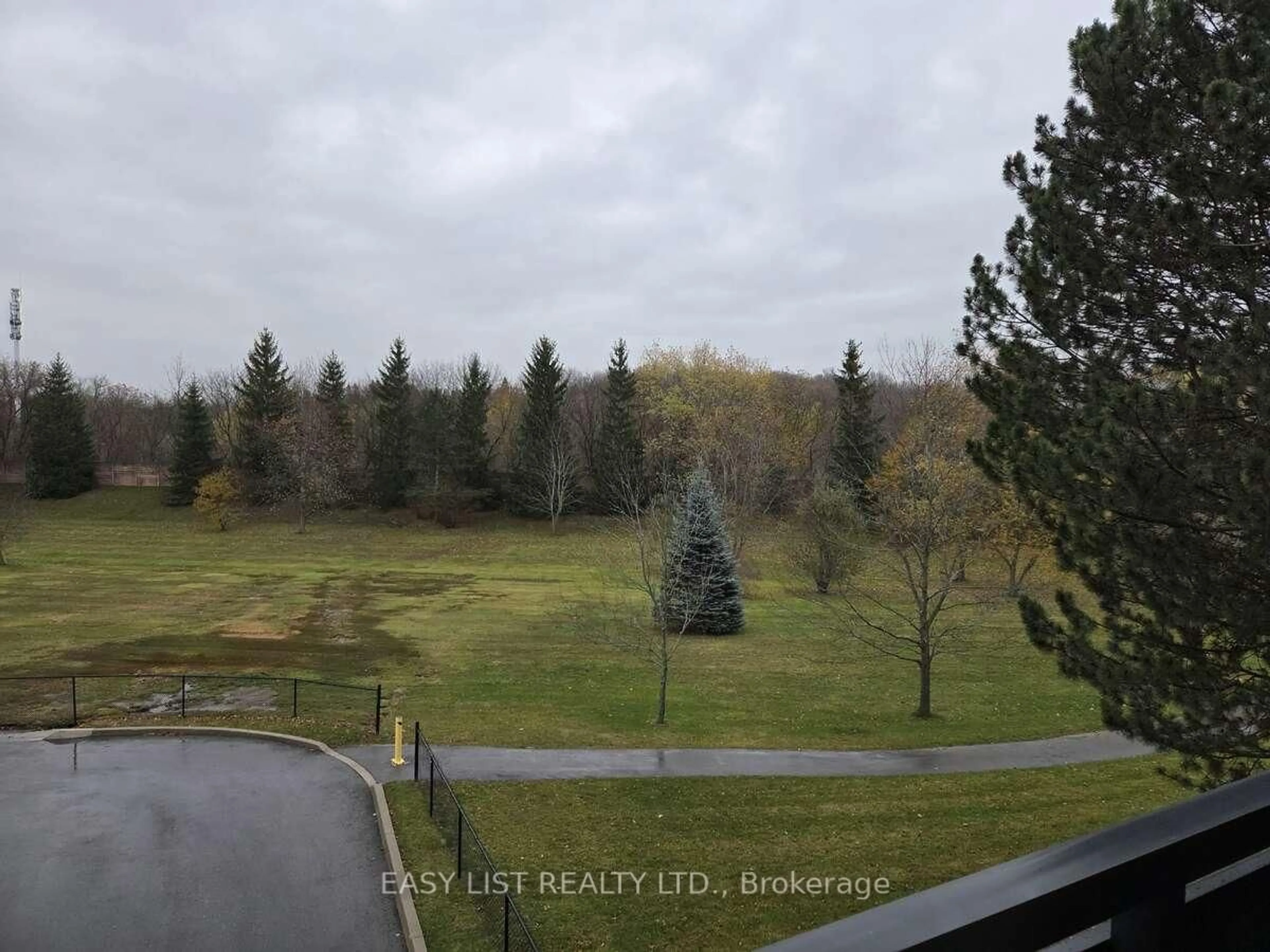 A pic from outside/outdoor area/front of a property/back of a property/a pic from drone, forest/trees view for 155 Main St #203, Newmarket Ontario L3Y 8C2