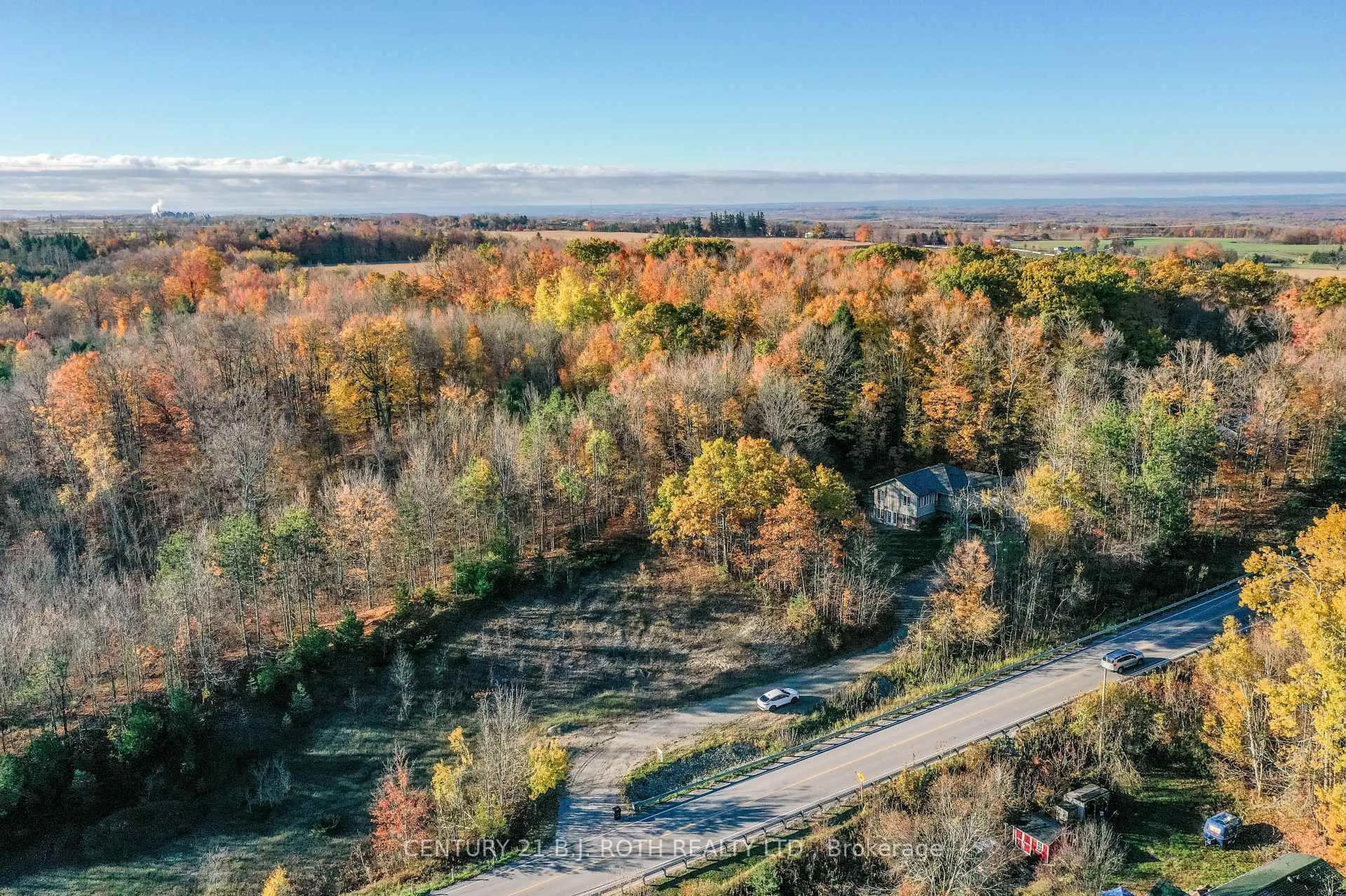 A pic from outside/outdoor area/front of a property/back of a property/a pic from drone, forest/trees view for 4927 25 Side Rd, Essa Ontario L4M 4S4