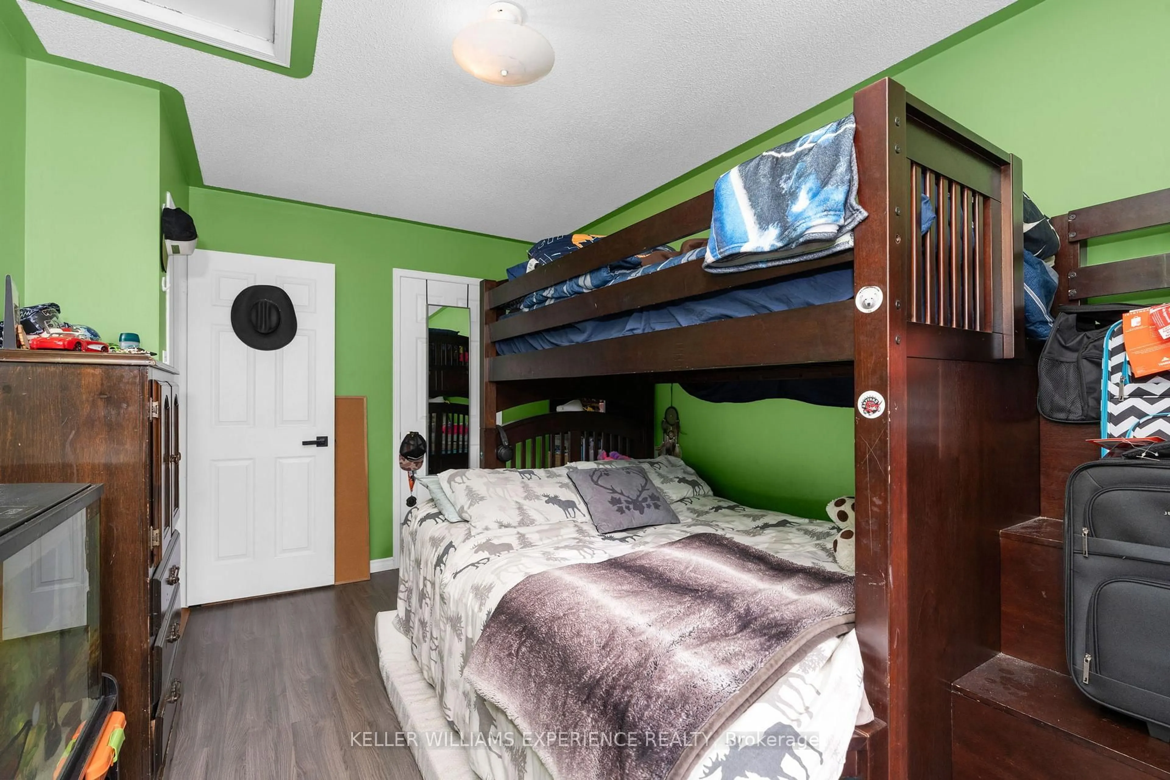 Bedroom with bed, wood/laminate floor for 13 Kate Aitken Cres, New Tecumseth Ontario L0G 1A0