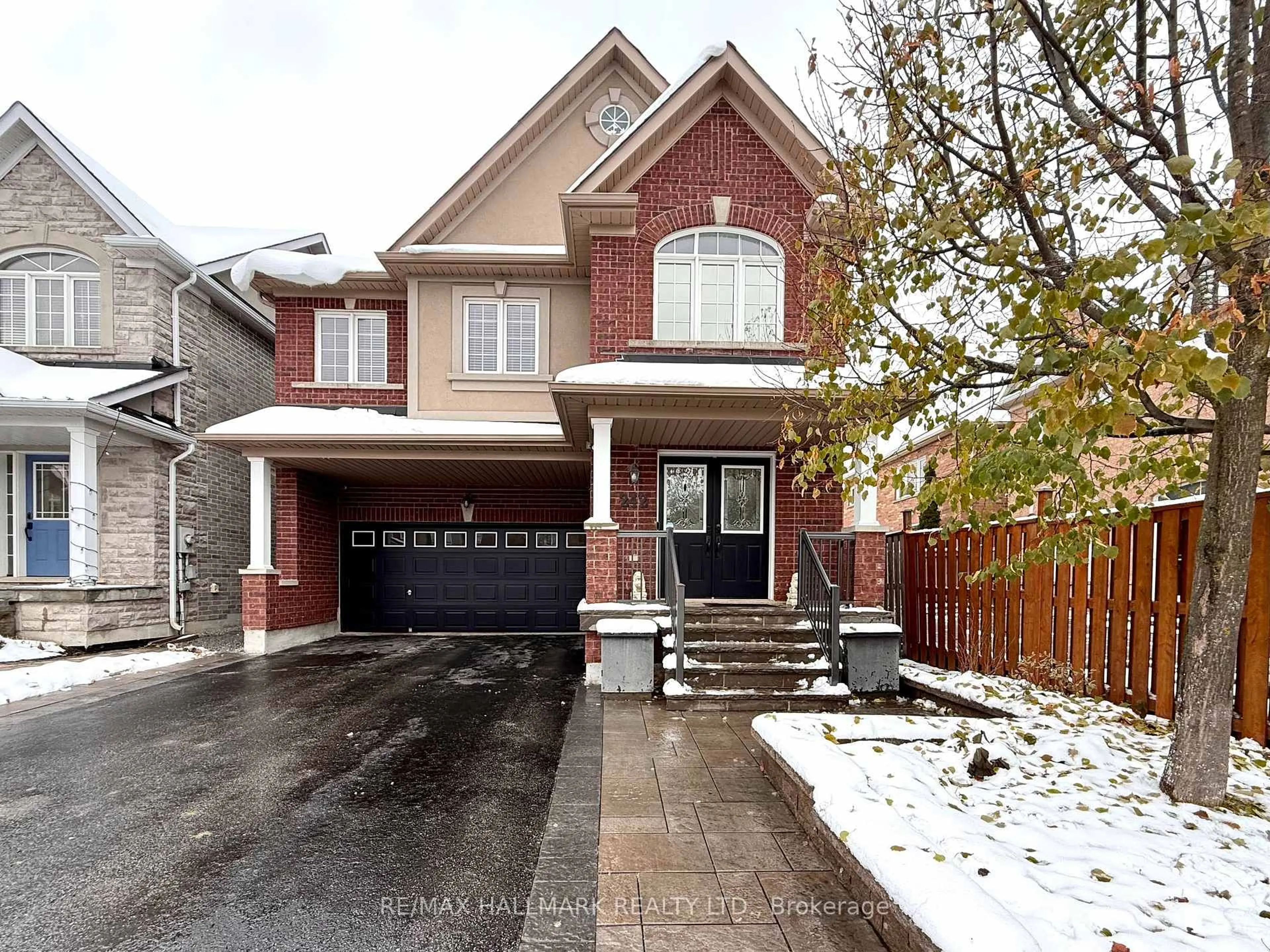 Home with brick exterior material, street for 242 Karl Rose Tr, Newmarket Ontario L3X 3J2