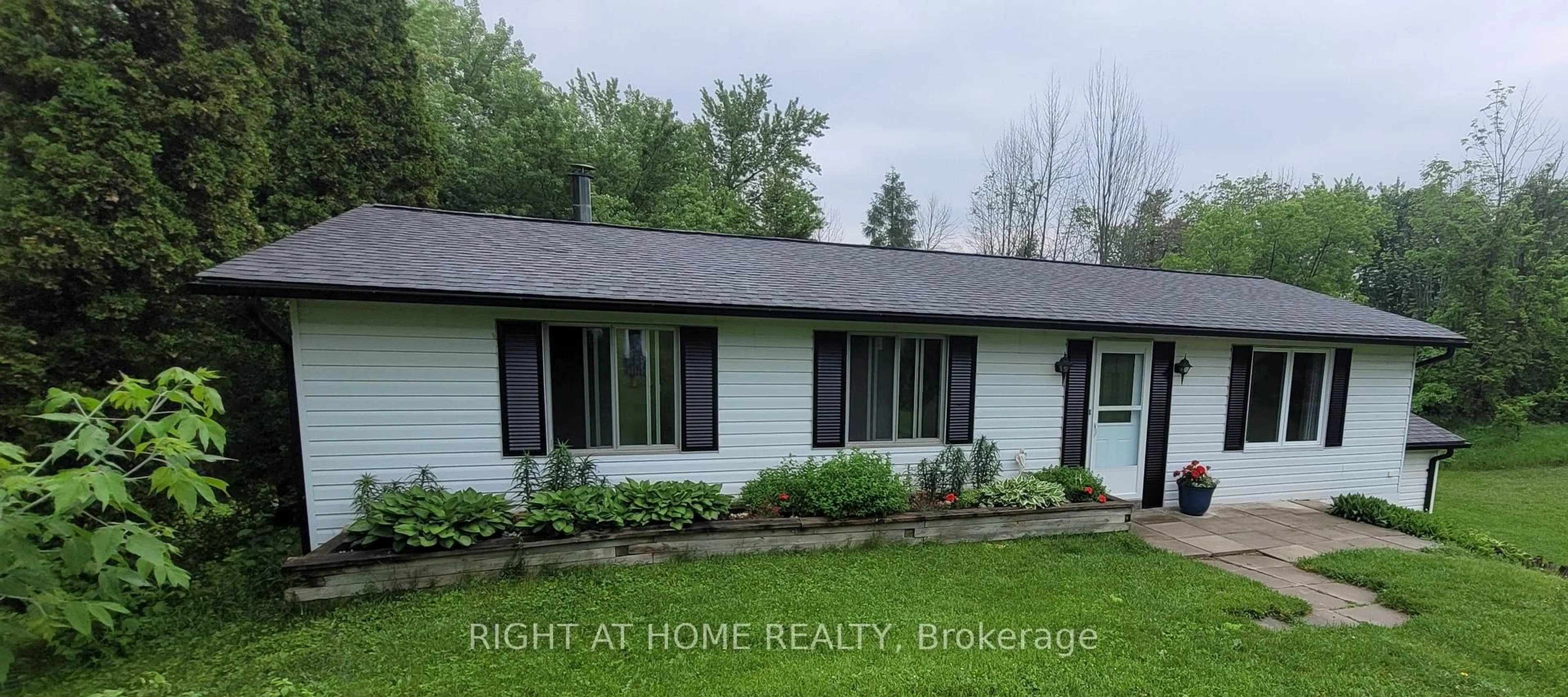 Home with vinyl exterior material, street for 2421 10 Sdrd, New Tecumseth Ontario L0G 1W0