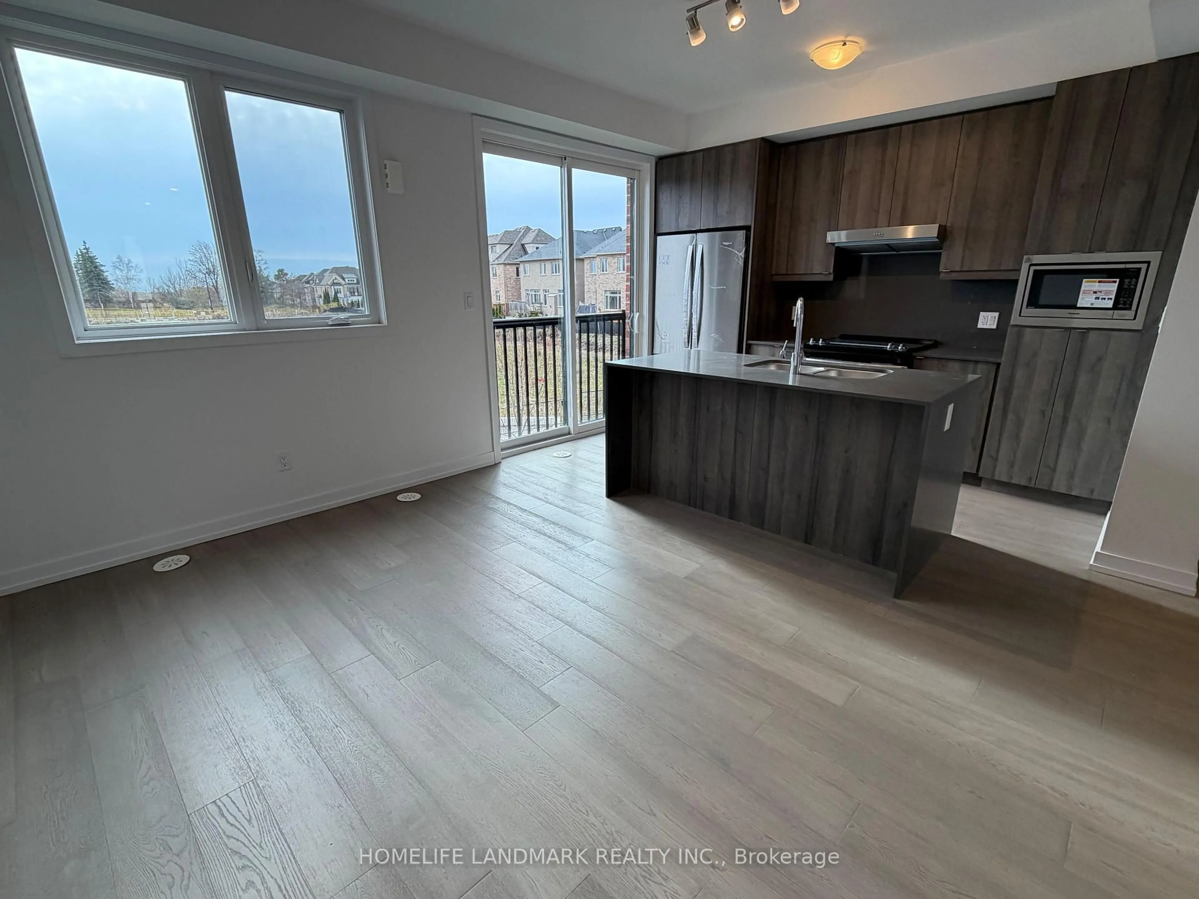 Open concept kitchen, wood/laminate floor for 23 Bancroft Lane, Richmond Hill Ontario L4E 1M1