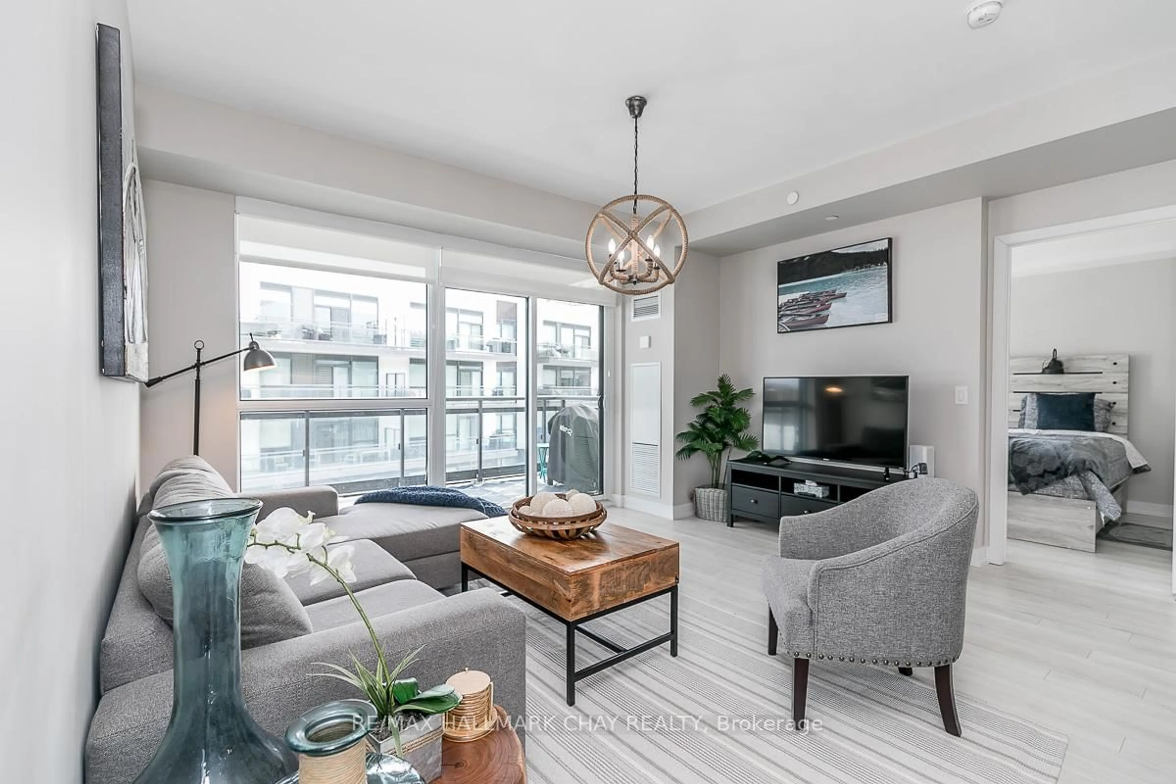 Living room with furniture, unknown for 333 Sea Ray Ave #D322, Innisfil Ontario L9S 2P7