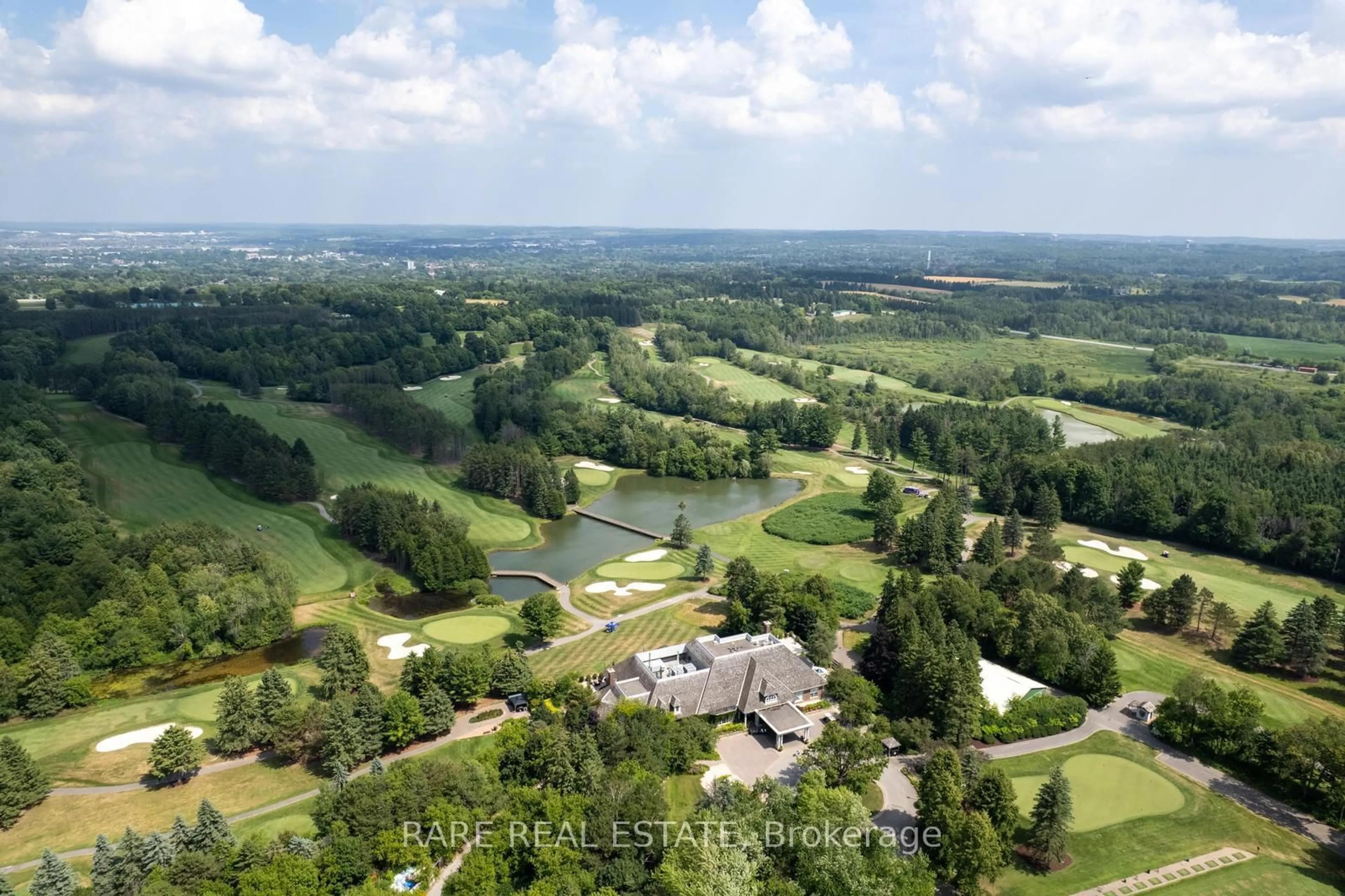 A pic from outside/outdoor area/front of a property/back of a property/a pic from drone, water/lake/river/ocean view for 40 Country Club Dr, King Ontario L7B 1M5