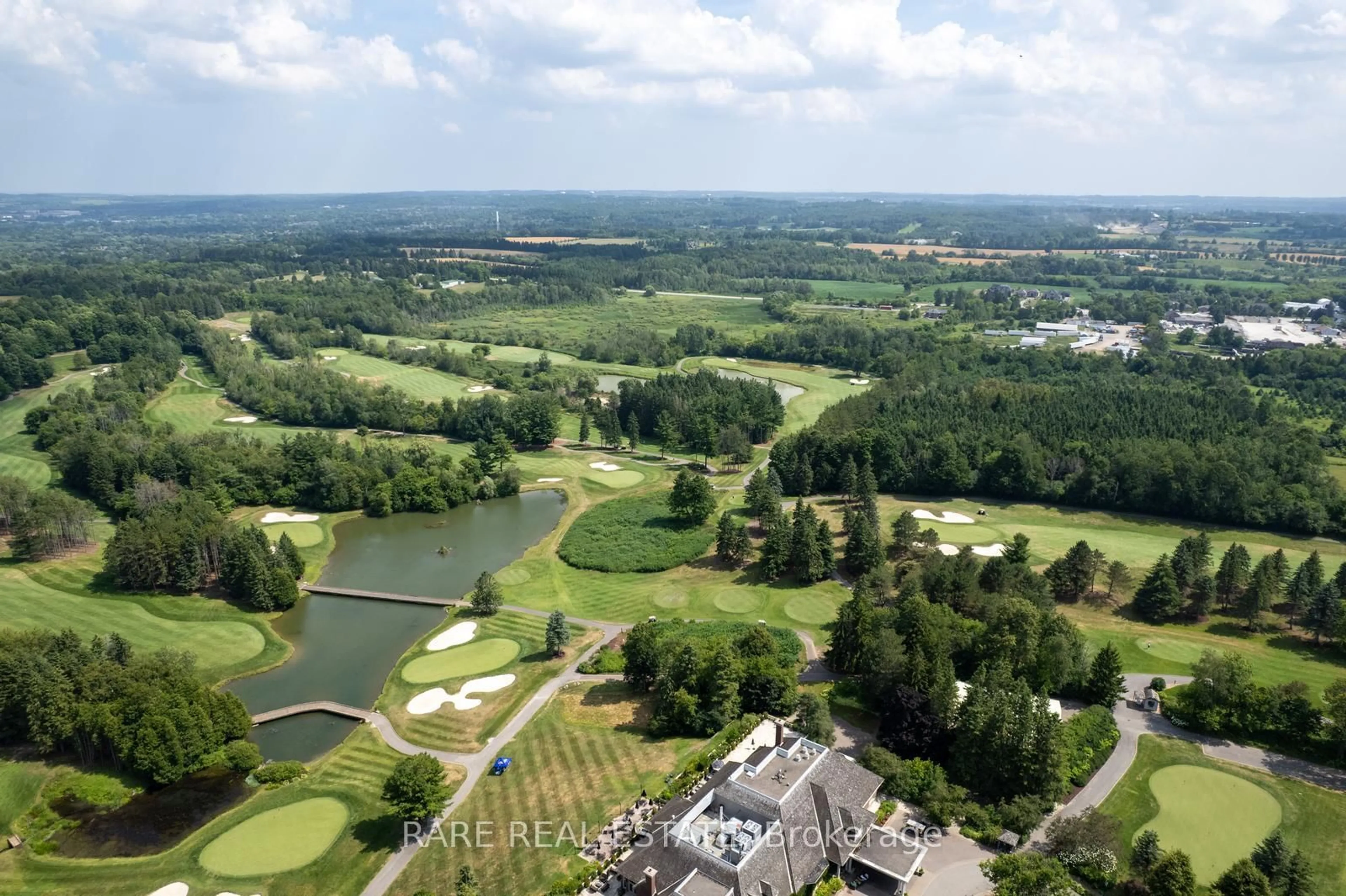 A pic from outside/outdoor area/front of a property/back of a property/a pic from drone, water/lake/river/ocean view for 40 Country Club Dr, King Ontario L7B 1M5