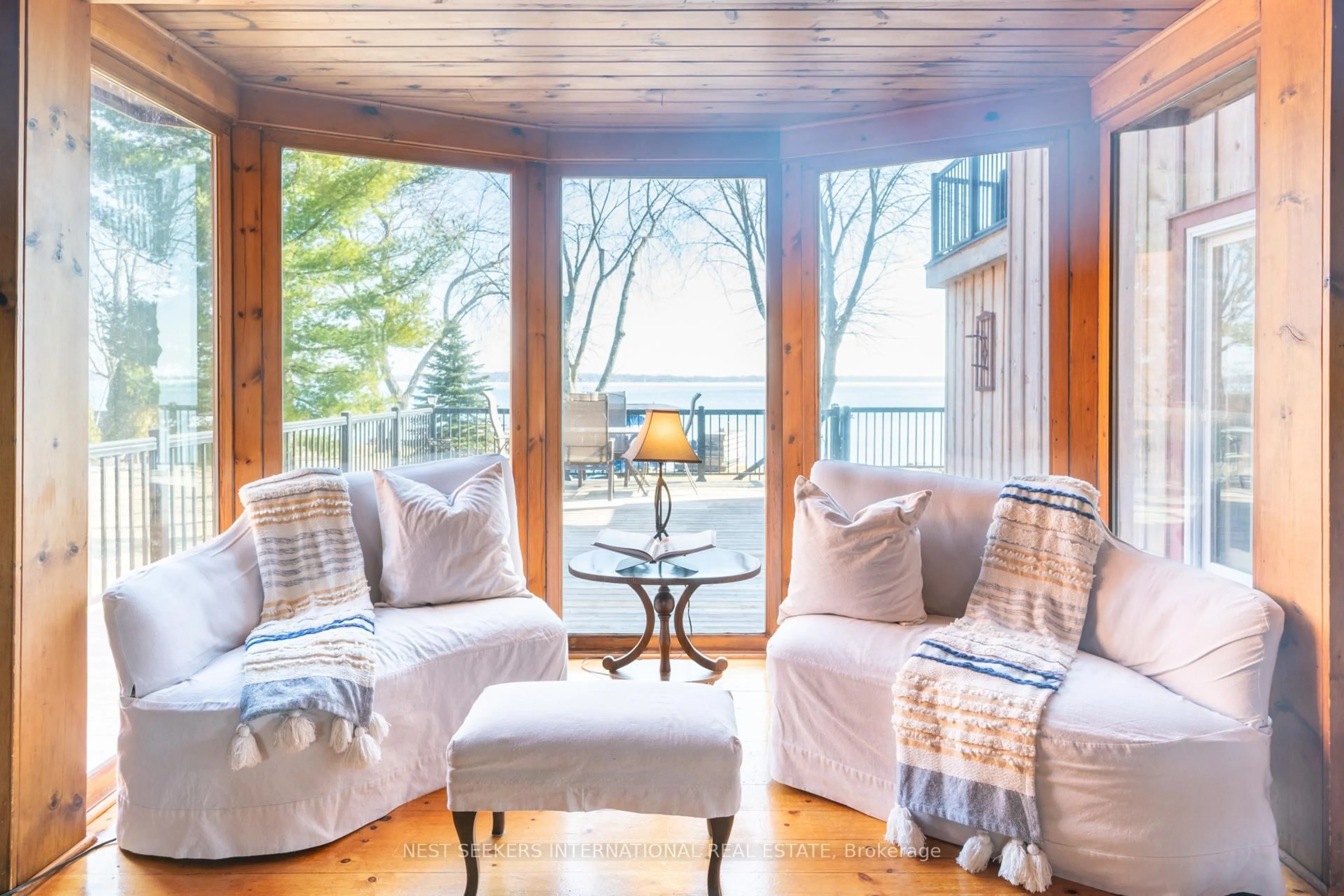 Living room with furniture, wood/laminate floor for 219 Bayshore Rd, Innisfil Ontario L0L 1K0