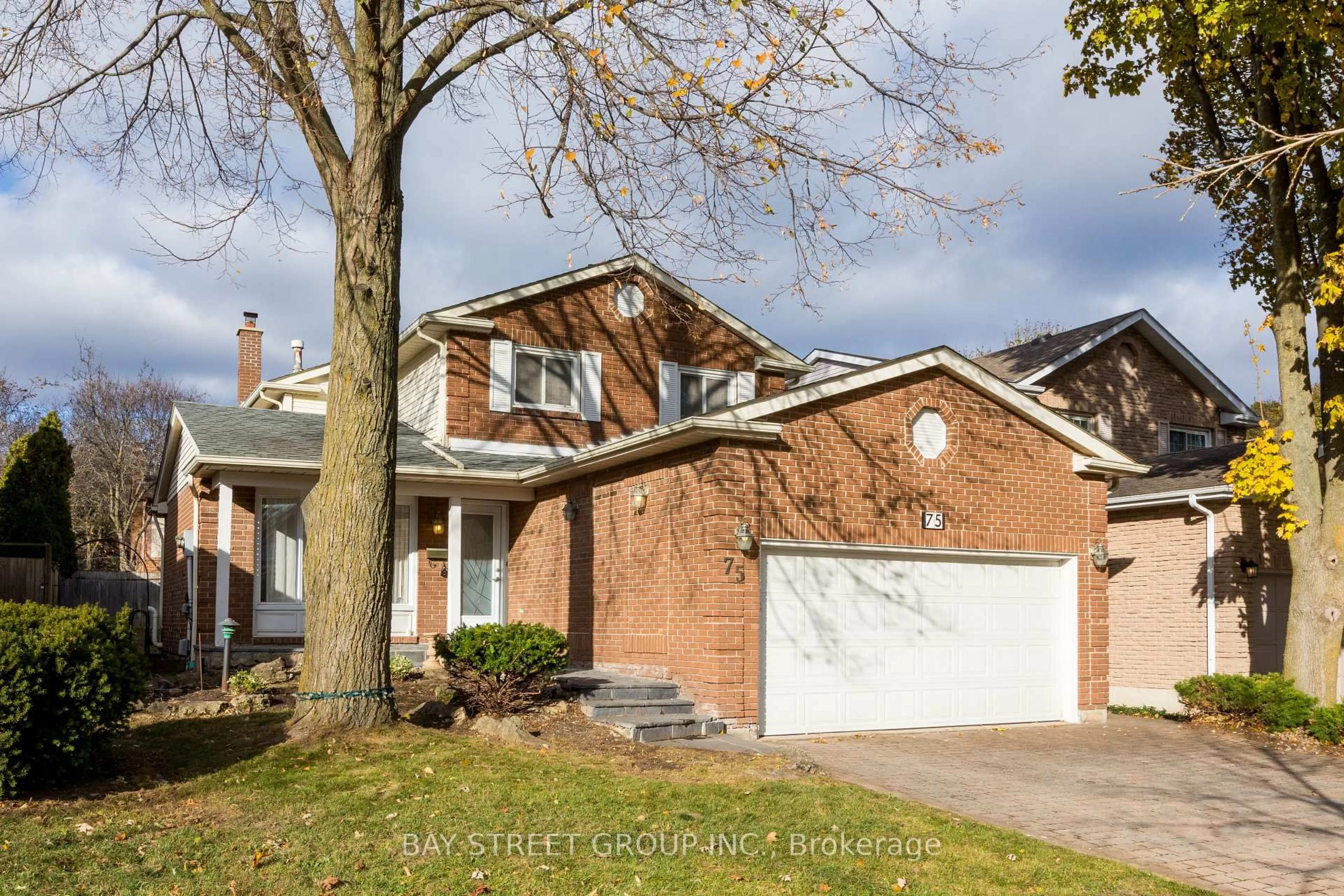 Home with brick exterior material, street for 75 Breckonwood Cres, Markham Ontario L3T 5G8