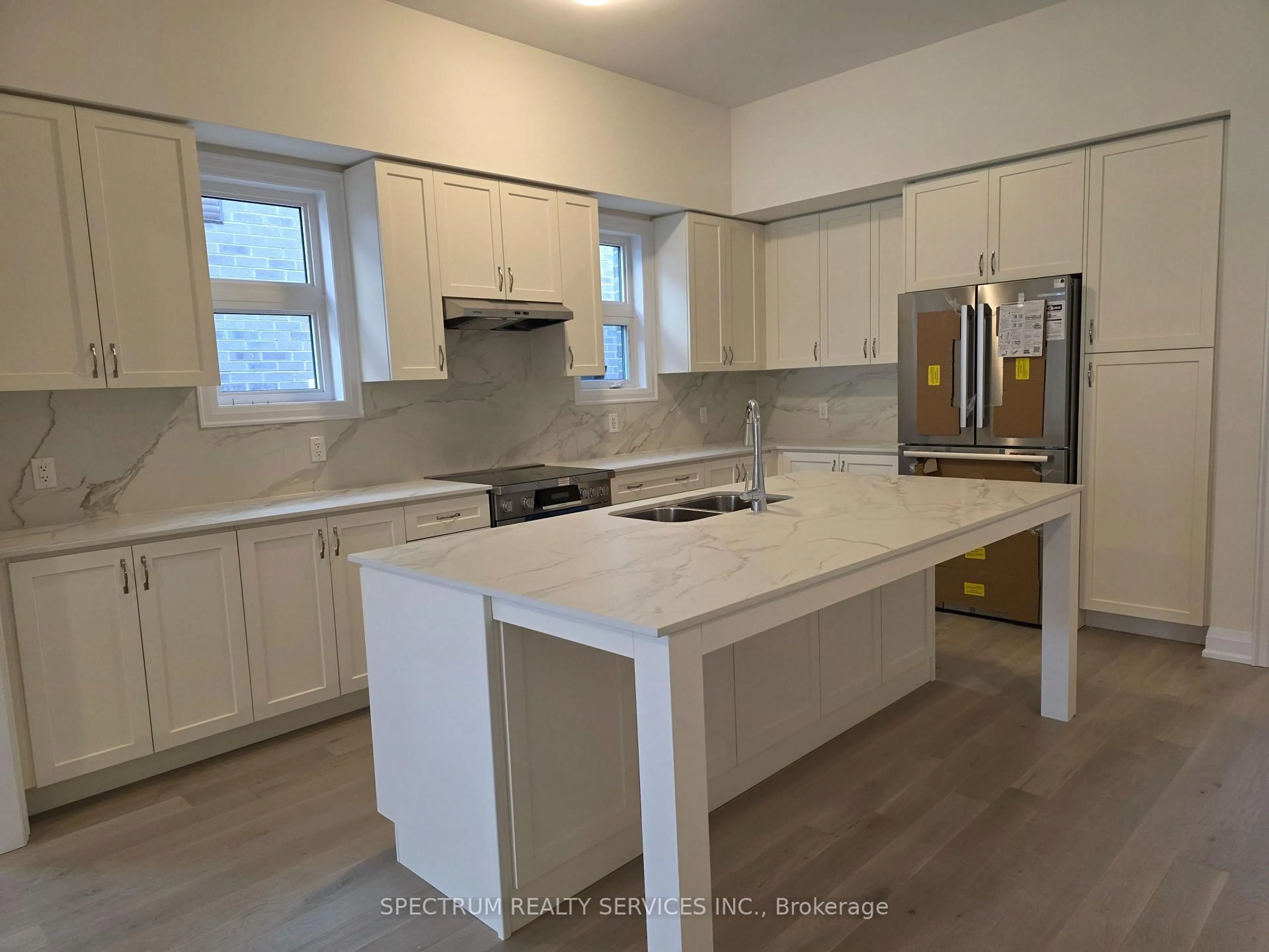 Open concept kitchen, wood/laminate floor for 84 Adario Cres, Vaughan Ontario L4H 4P7