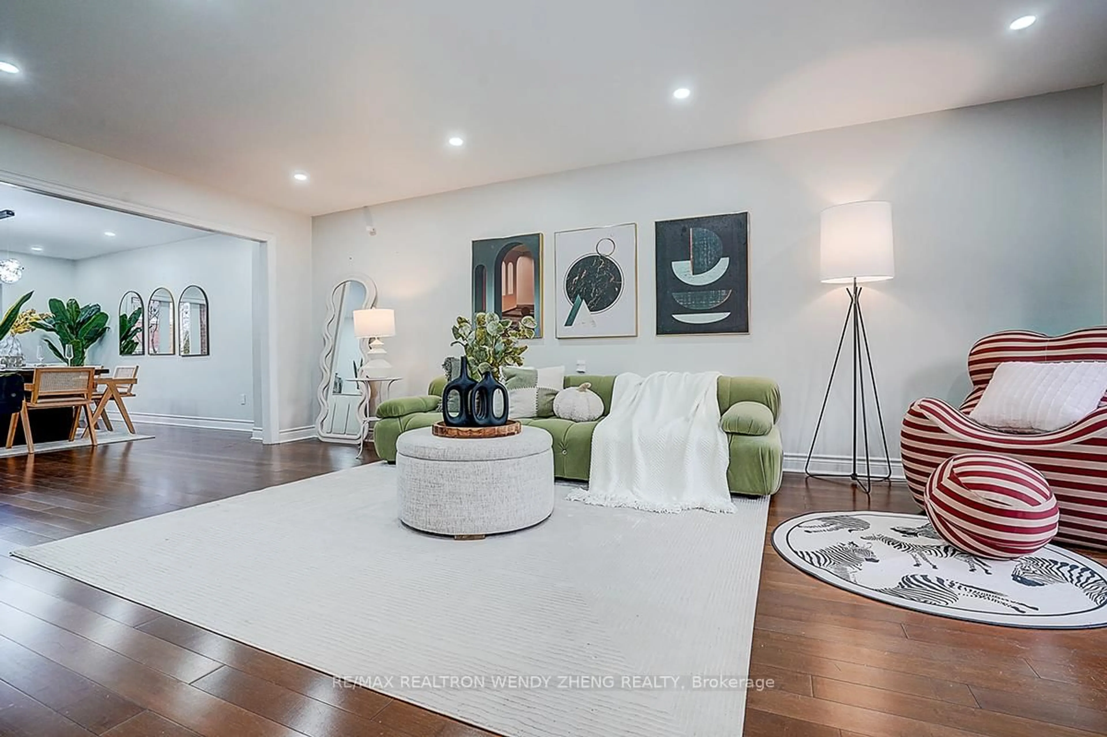 Living room with furniture, wood/laminate floor for 22 Saddlewood Crt, Markham Ontario L3R 8S7