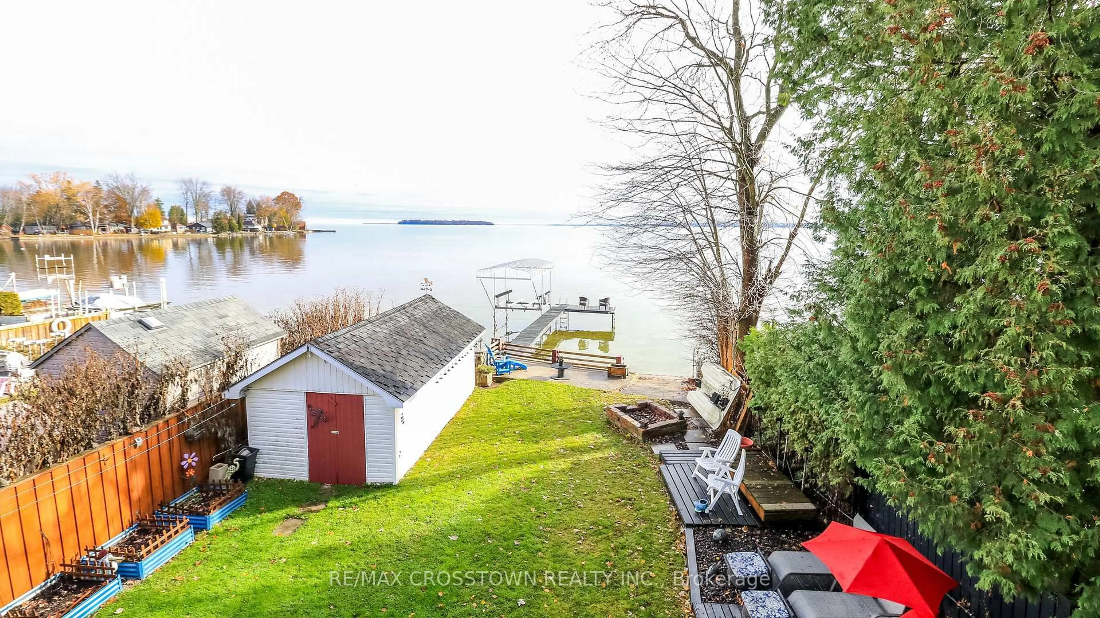 A pic from outside/outdoor area/front of a property/back of a property/a pic from drone, water/lake/river/ocean view for 2325 Crystal Beach Rd, Innisfil Ontario L9S 3W8