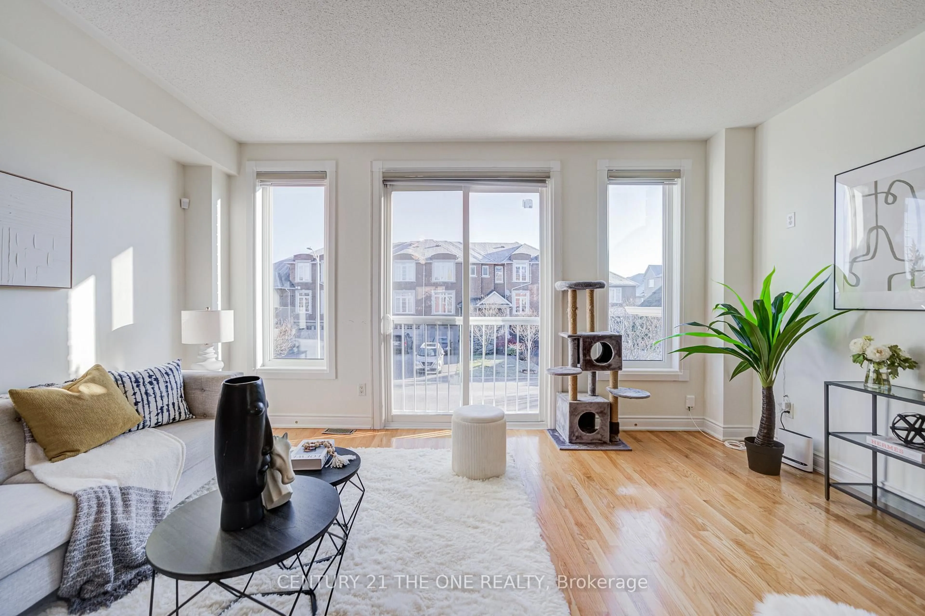Living room with furniture, wood/laminate floor for 46 Mistywood Cres, Vaughan Ontario L4J 9E6