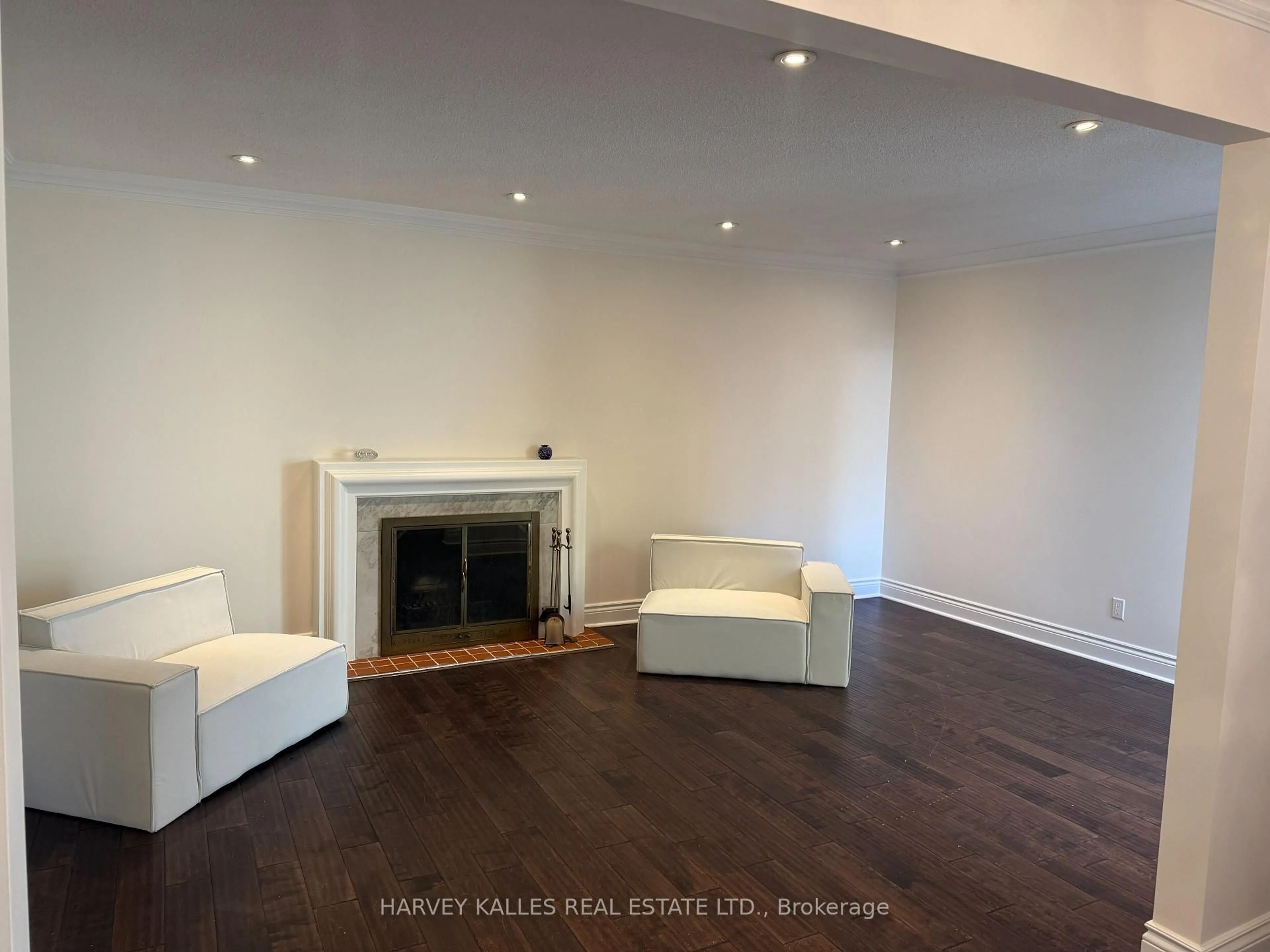 Living room with furniture, wood/laminate floor for 62 Dersingham Cres, Markham Ontario L3T 4E8